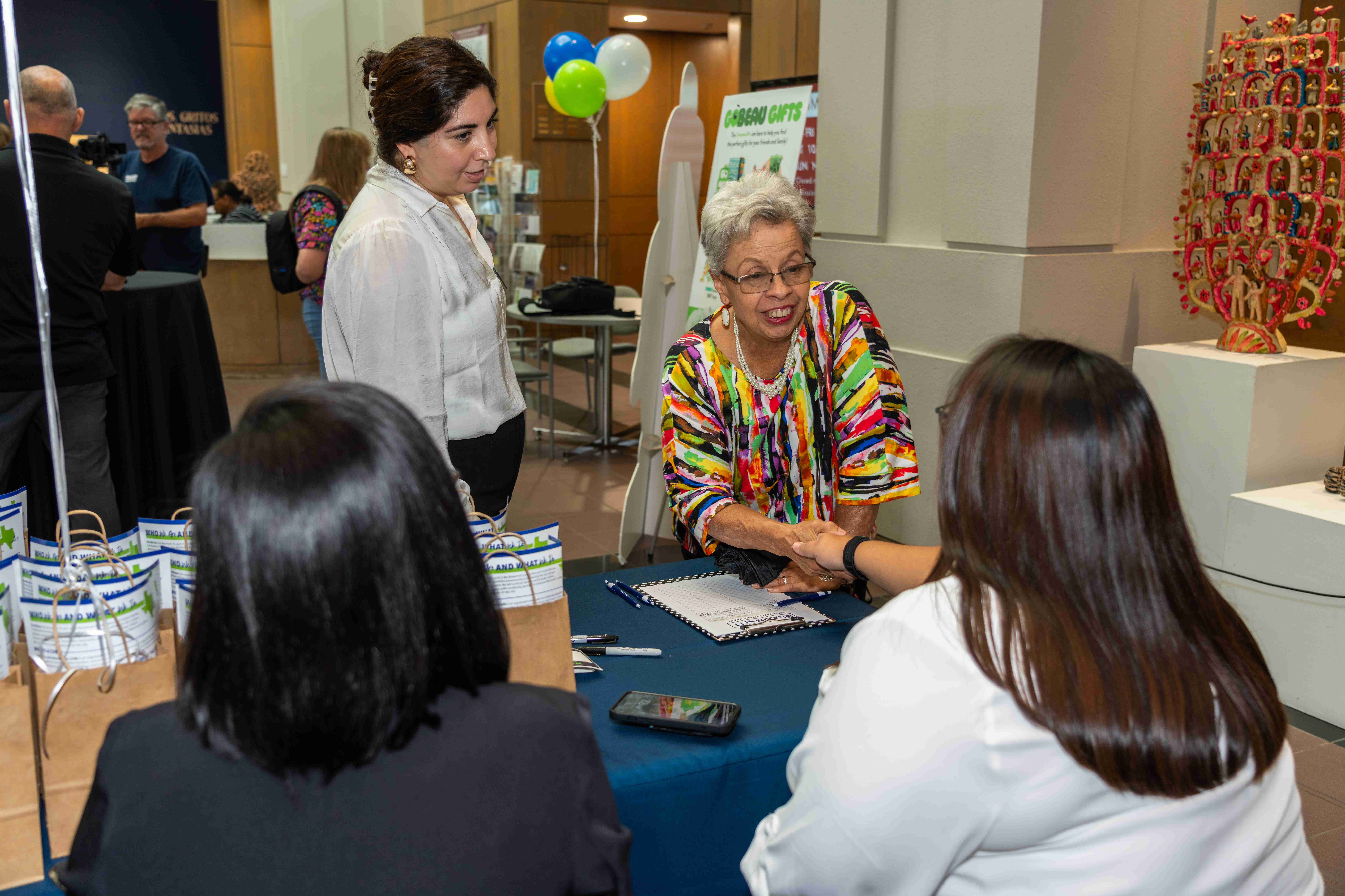 Business Event with volunteers connecting with residents.