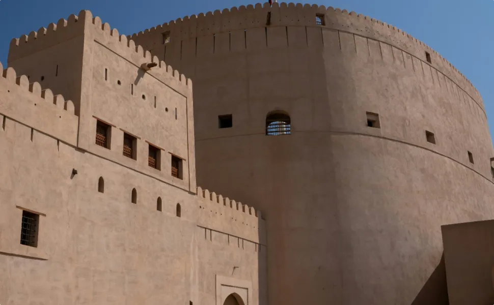a large building with a clock on the side of it