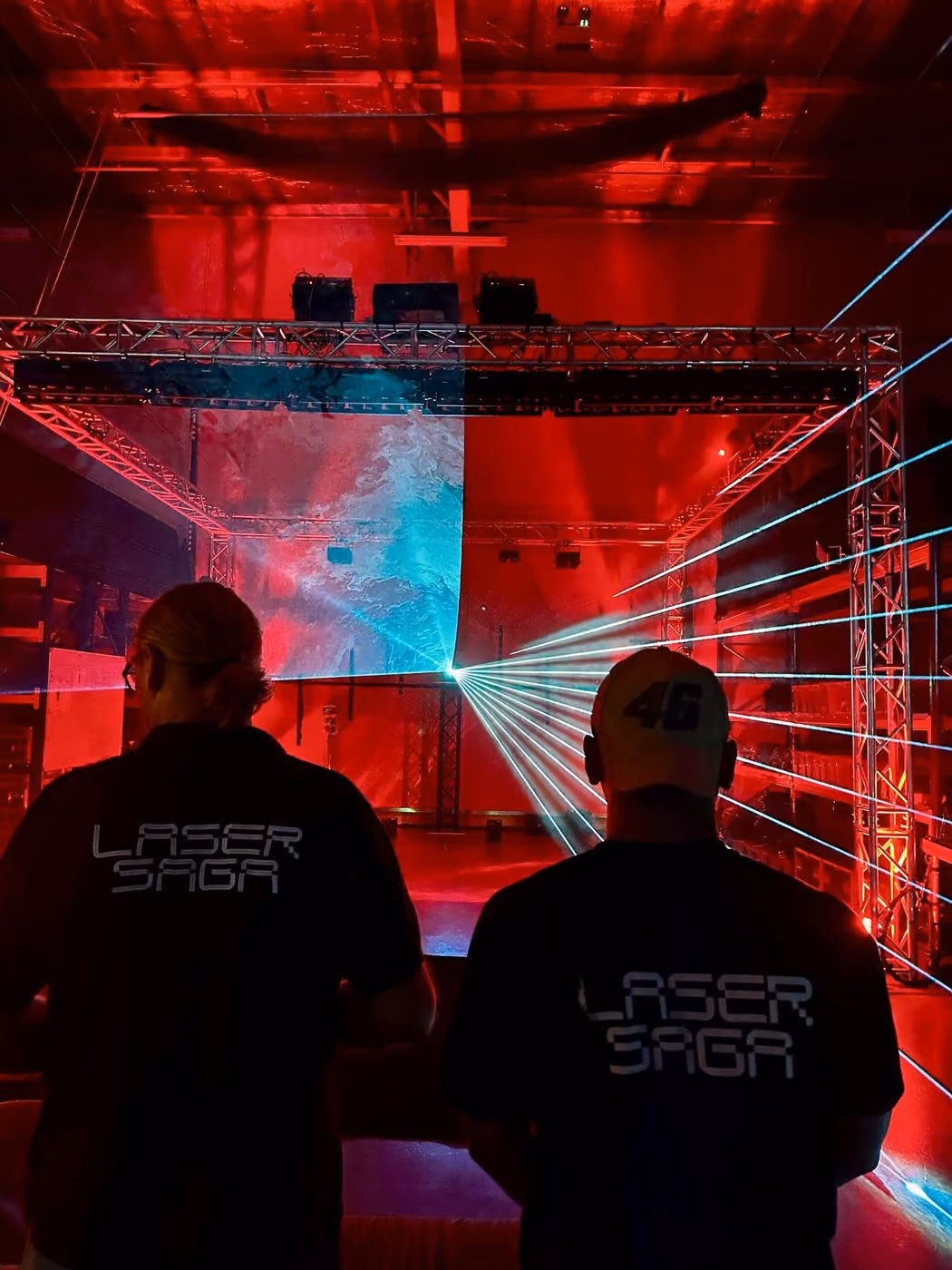 Laser Saga crew testing lasers in the warehouse