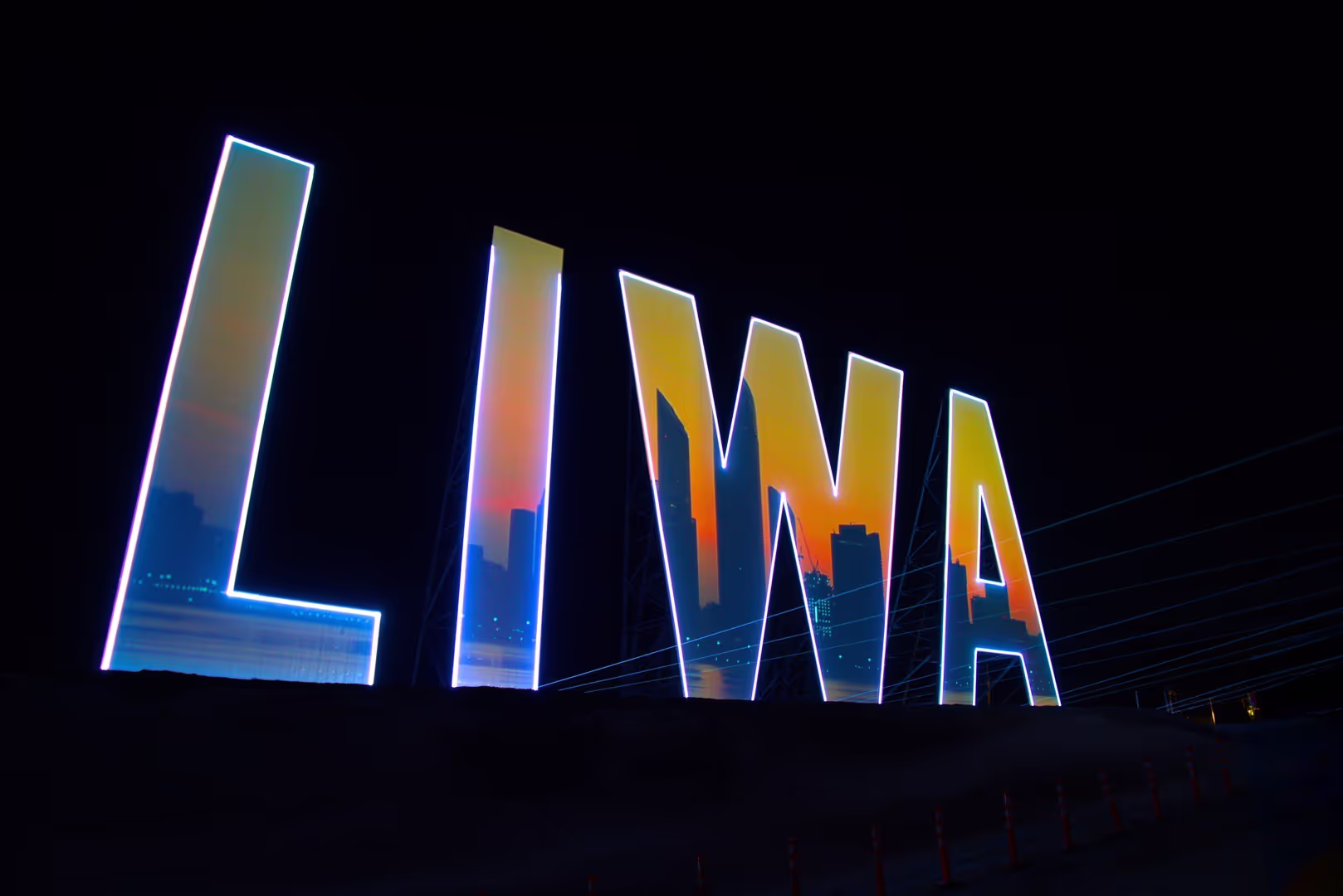 Desert-palm mapping on the LIWA letters at night, LIWA Signboard Opening, Abu Dhabi, UAE