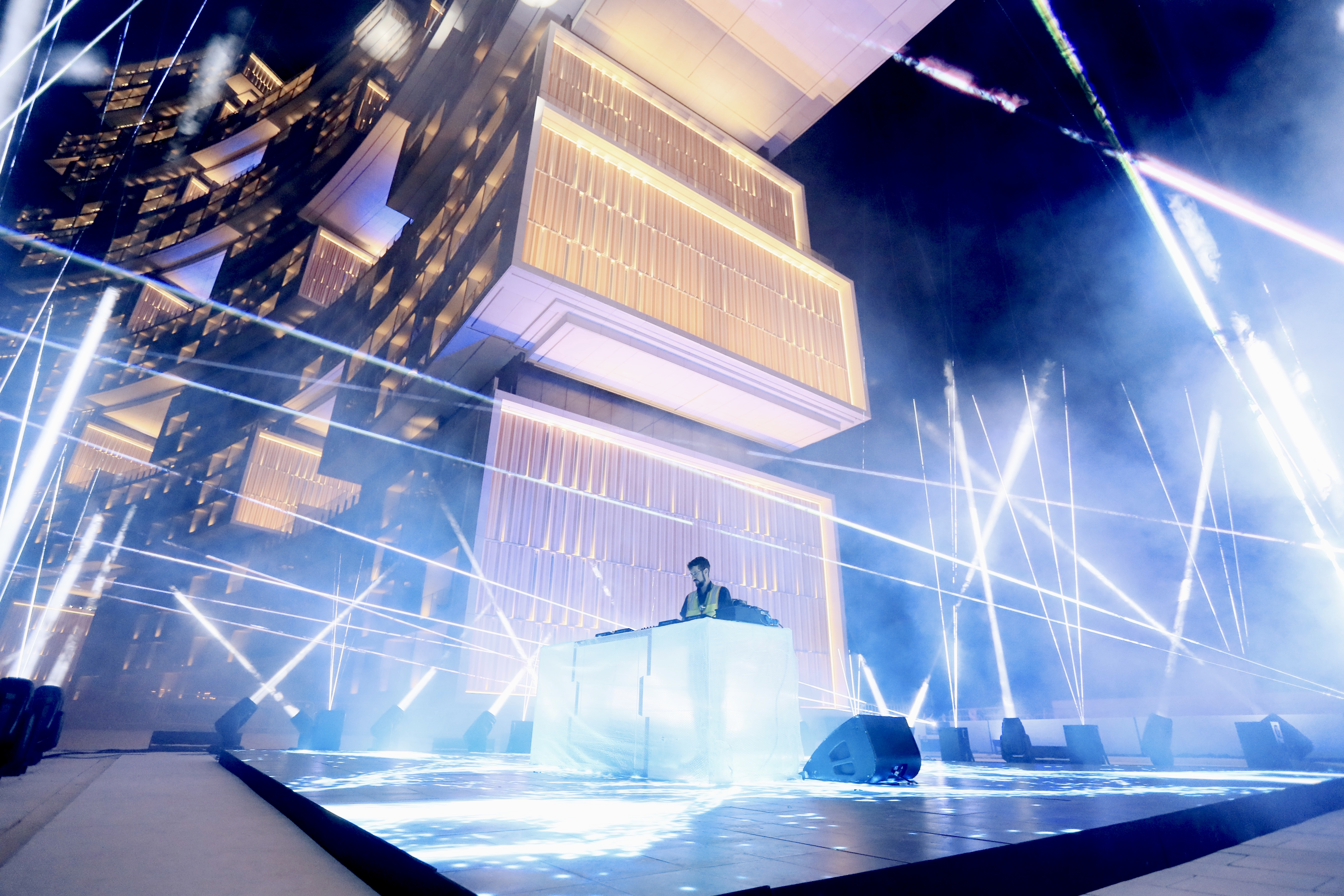 Laser beams and haze over the DJ on the stage set, Tiesto & Tate McRae Music Clip Dubai