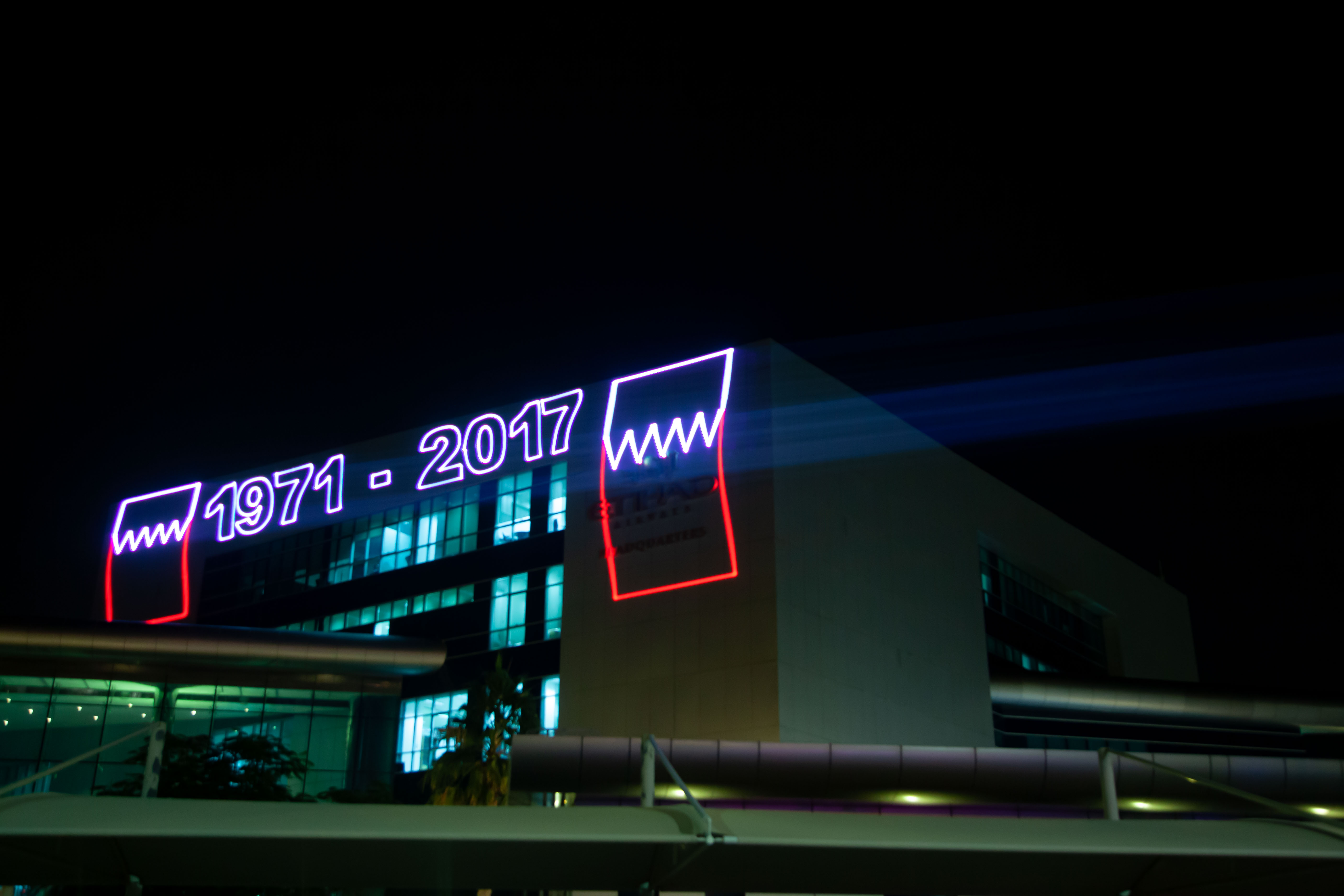 Anniversary logo traced in laser on the facade, Etihad HQ Laser Mapping, Abu Dhabi, UAE