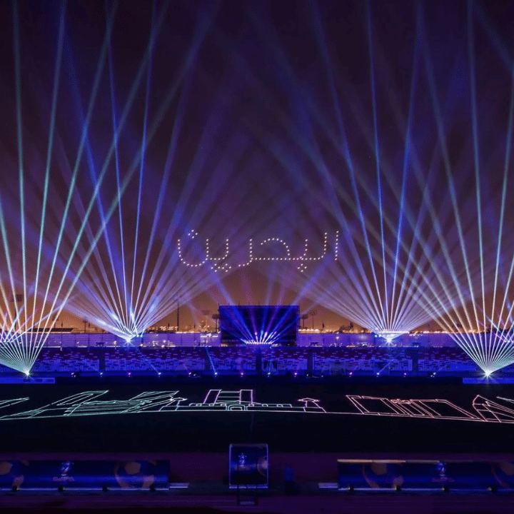 Laser fans and laser-drawn graphics over an arena show