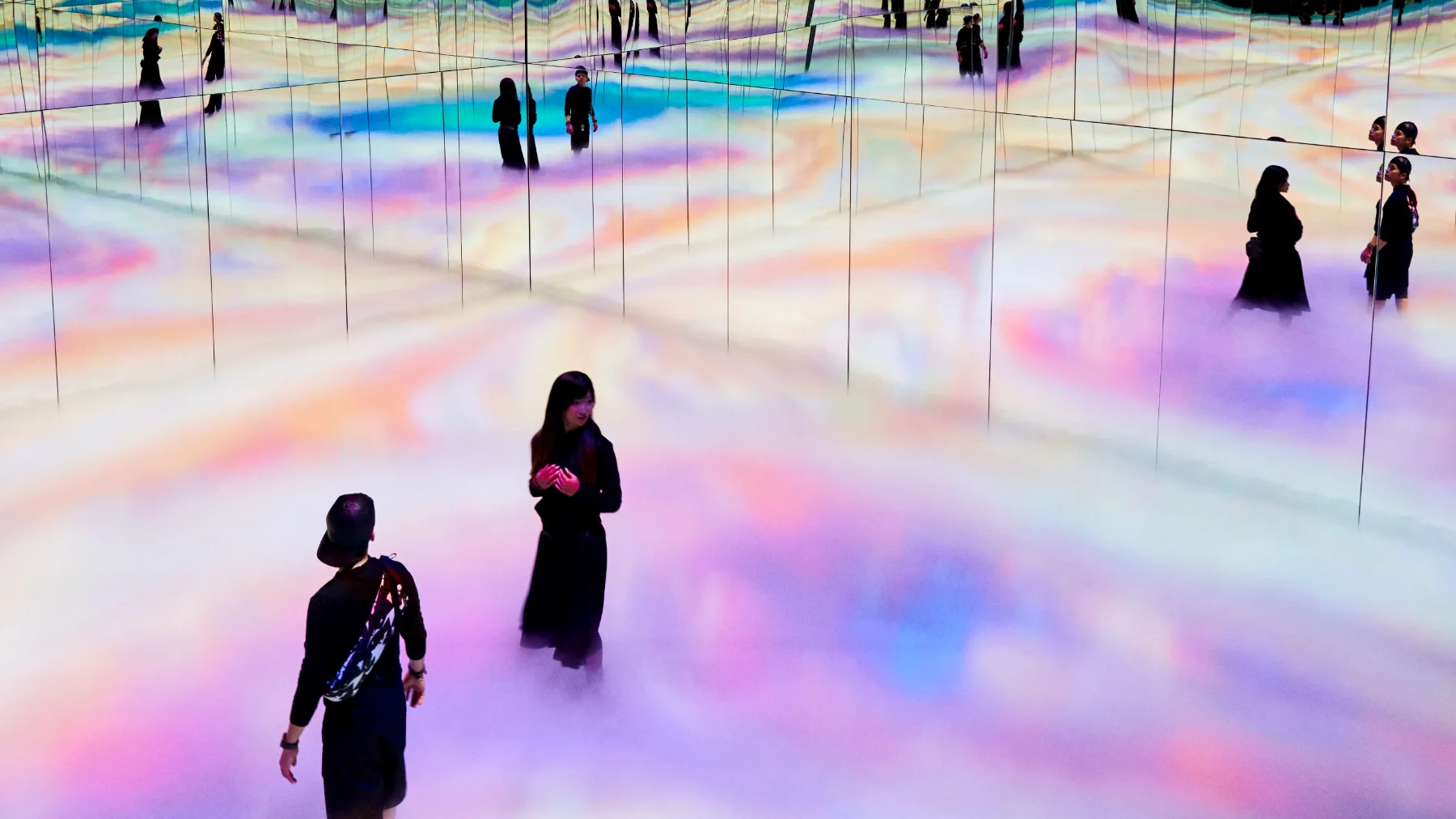 People walking on a projected floor of colour, EXPO 2020 Be There shoot, Dubai