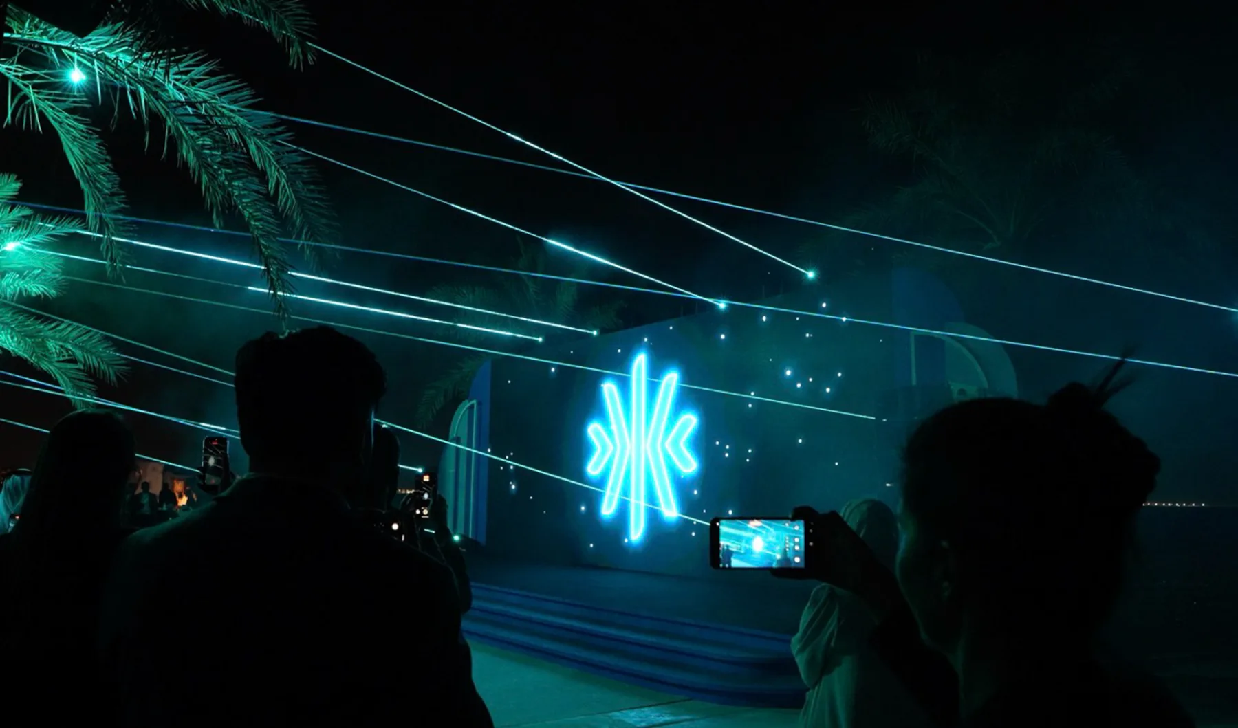 Guest filming the logo on stage, ADGM 10th Anniversary, Abu Dhabi