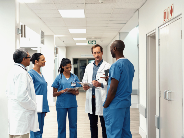 Group of ethnically diverse physicians having a discussion.