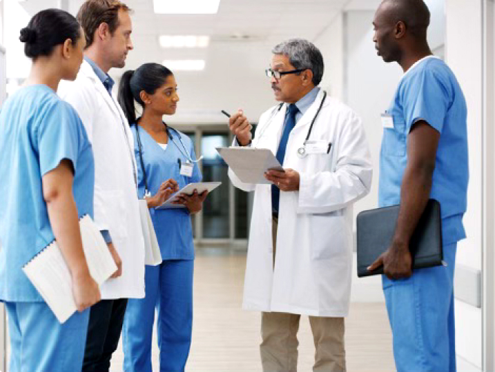 Group of ethnically diverse physicians having a discussion.