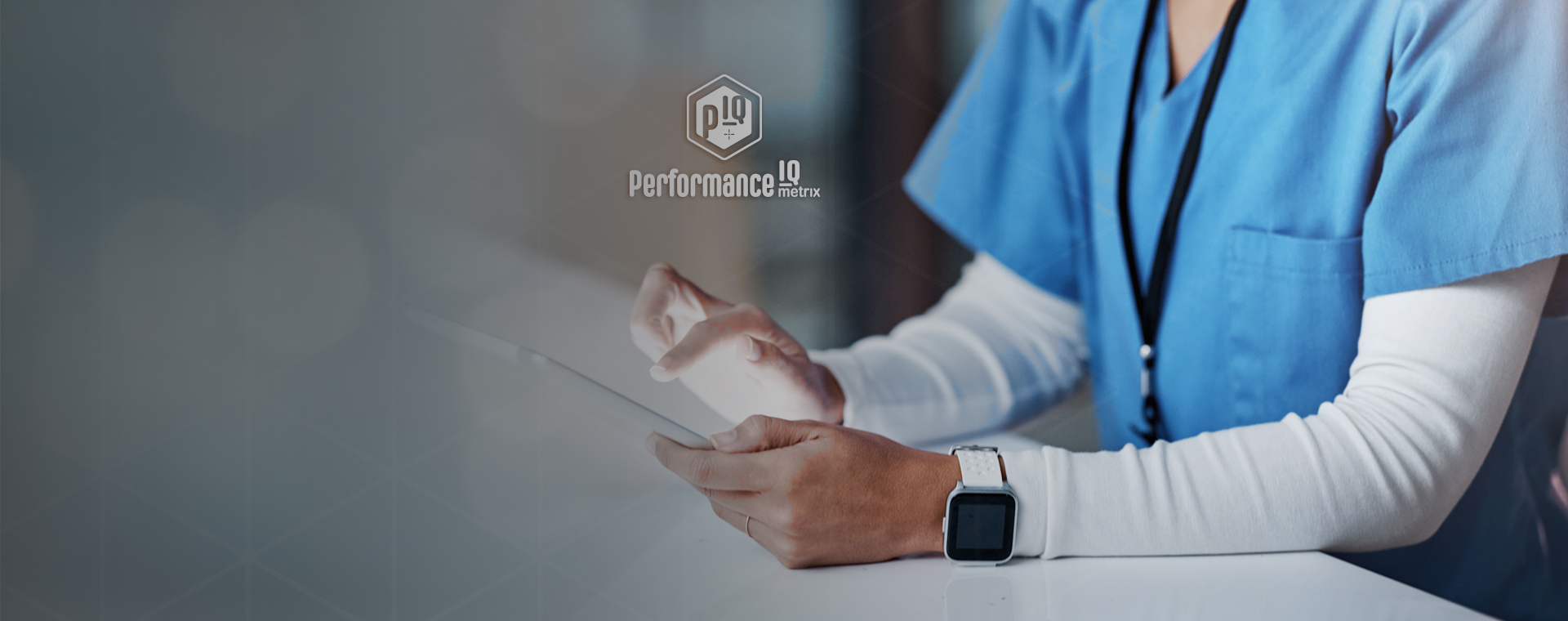 PerfomanceIQ Metrix hero image of female doctor working on digital tablet.