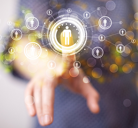 Stylistic composited image of hands pointing to group communication icons.