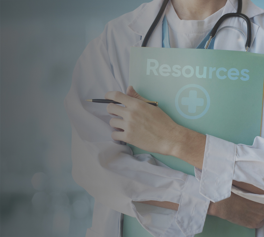 A female physician holding a document entitled resources.