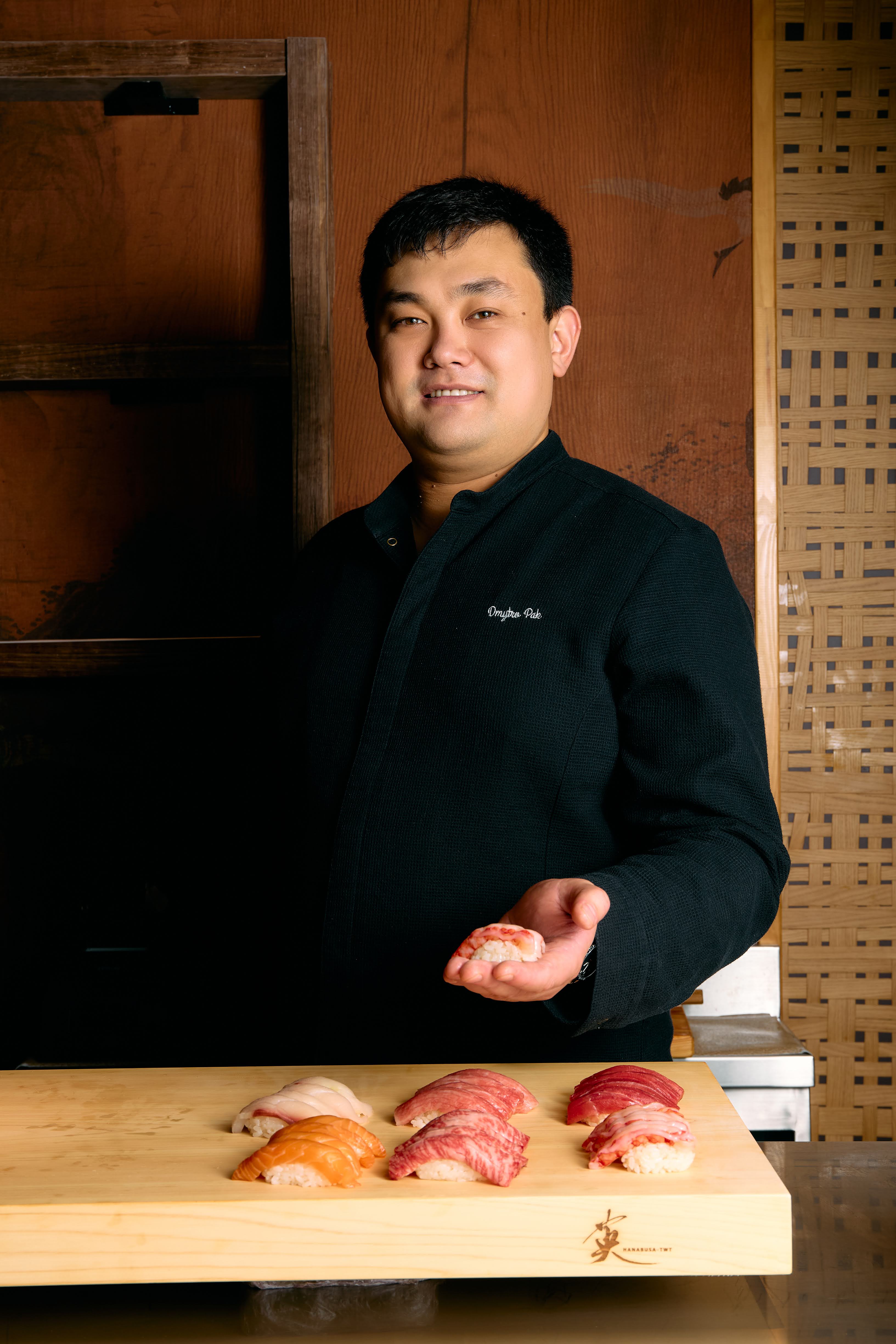 Chef preparing sushi at the Omakase counter