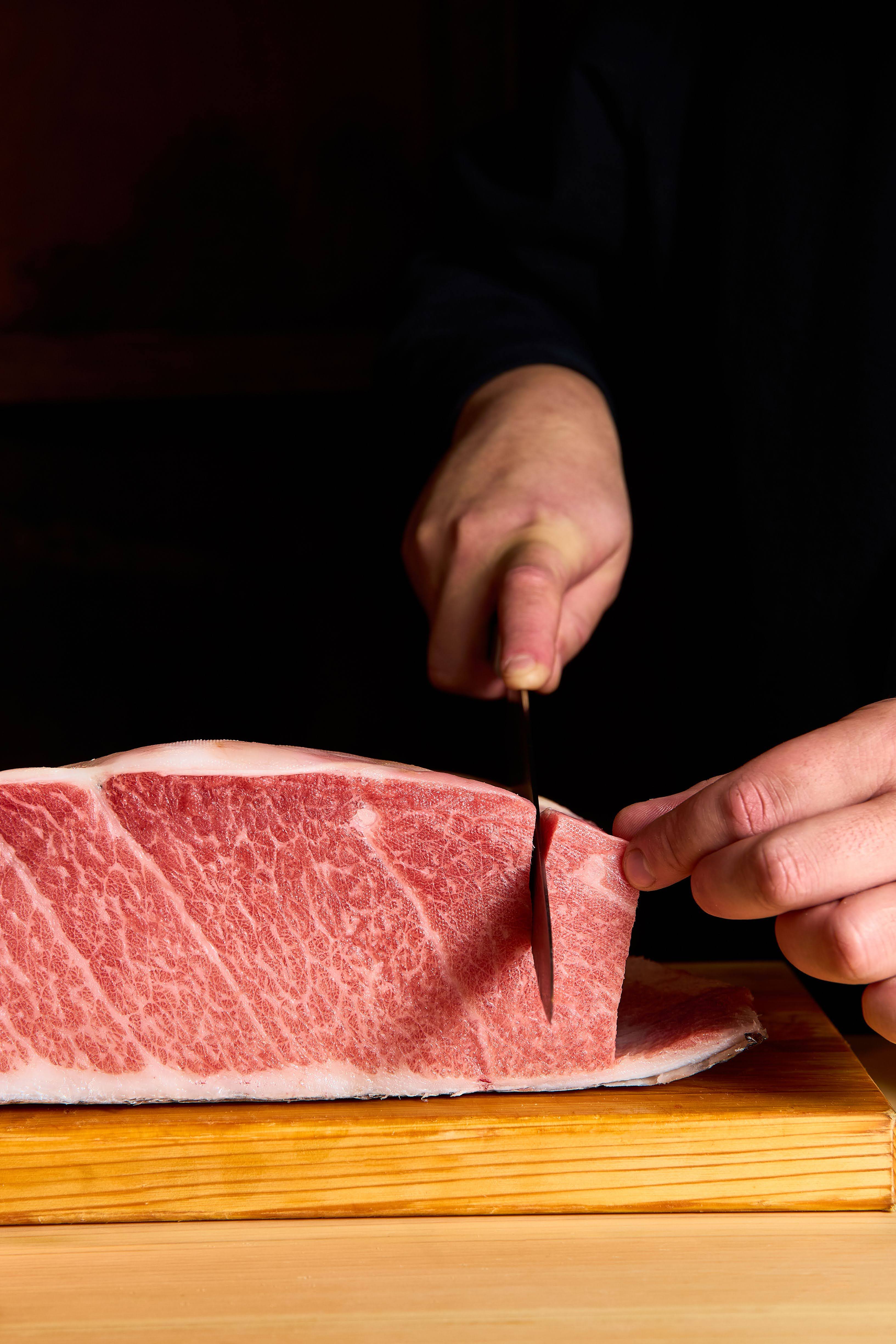 Chef slicing wagyu tuna belly