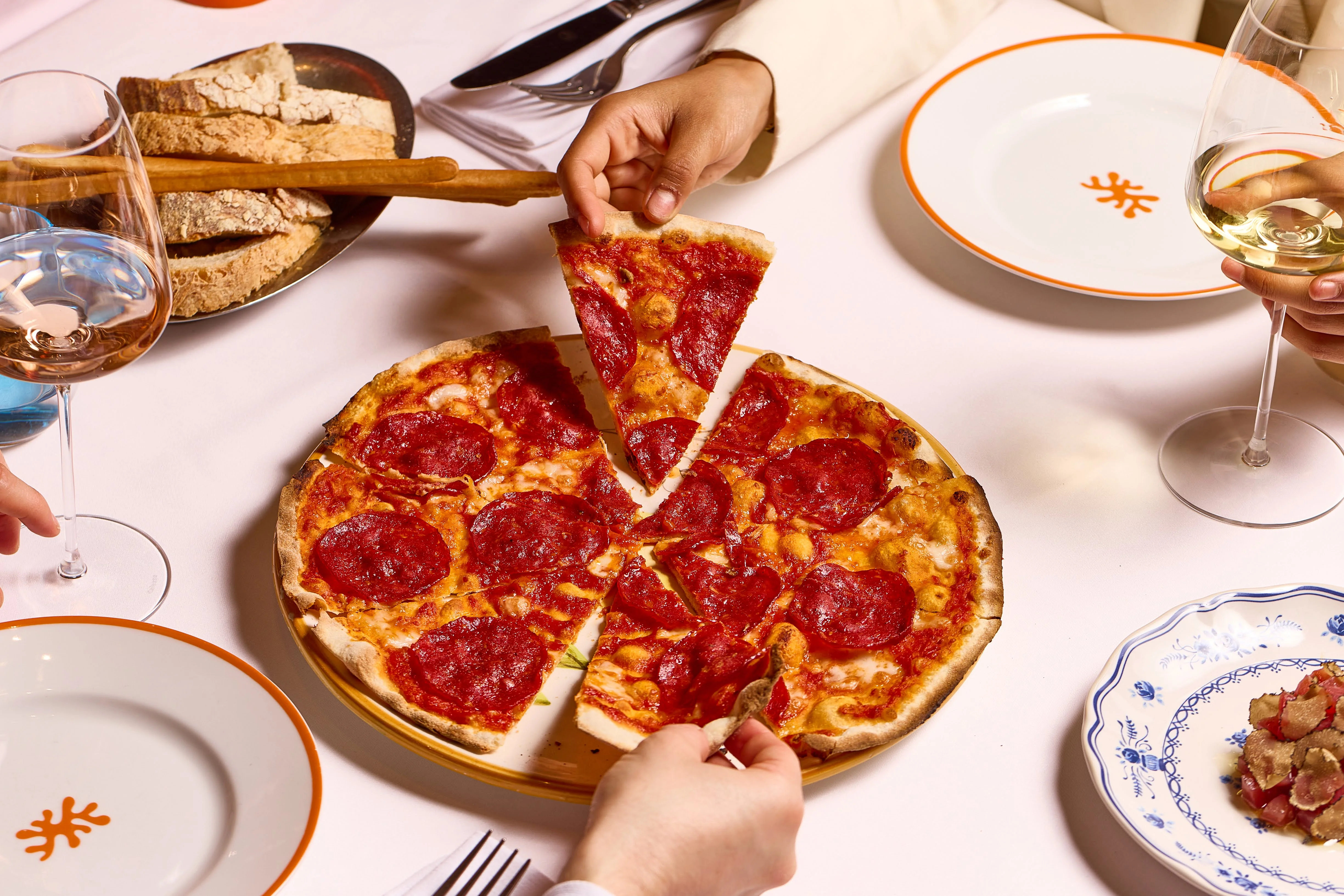 Wood-fired Pizza Diavola with buffalo mozzarella and spicy salami