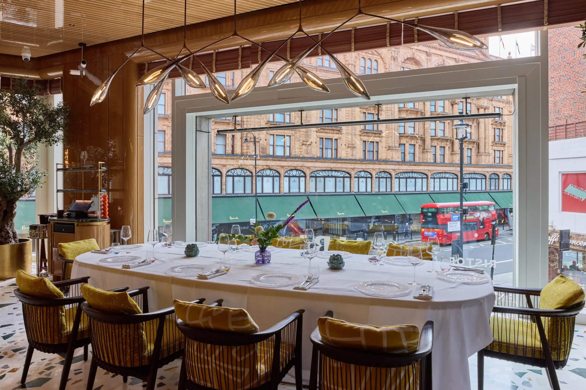 A table set in the window at ALBA with Harrods opposite, Italian restaurant in Knightsbridge