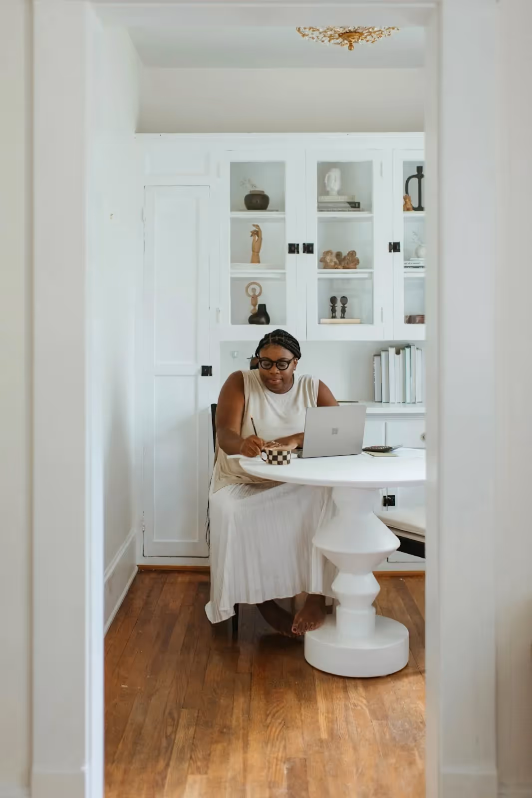 Small business owner working from her house.