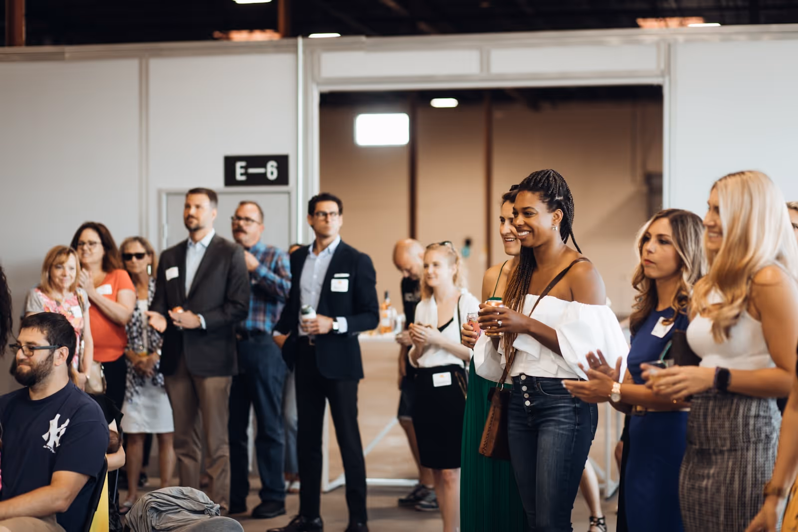 People standing around a co-warehousing facility during an event