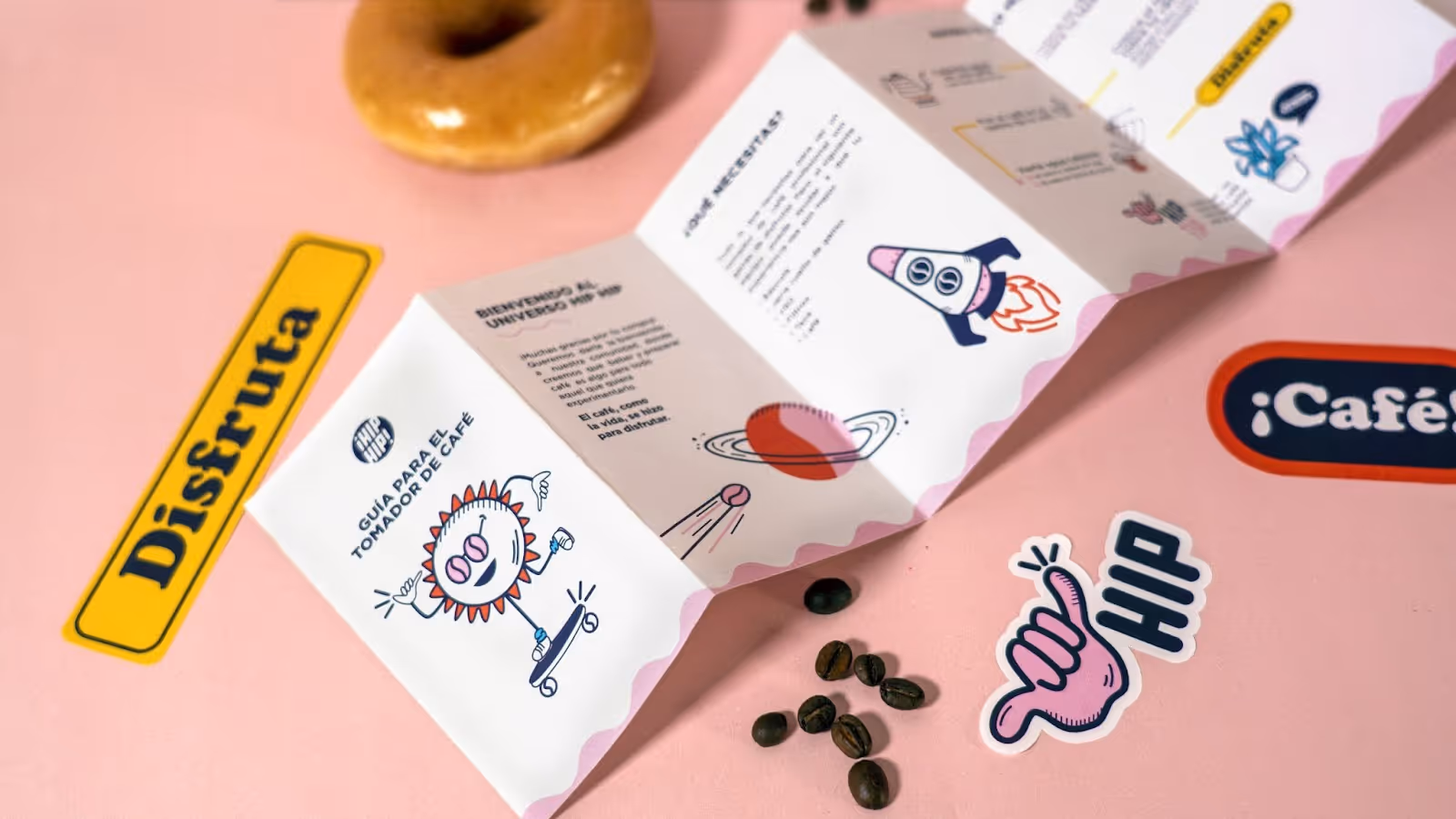 A brand pamphlet with bright colorts, quirky icons like a sun on a skateboard, a rocketship, and more.
