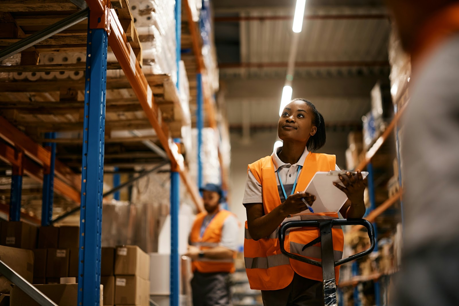 A warehouse worker using a batch picking strategy to pick orders for fulfillment.