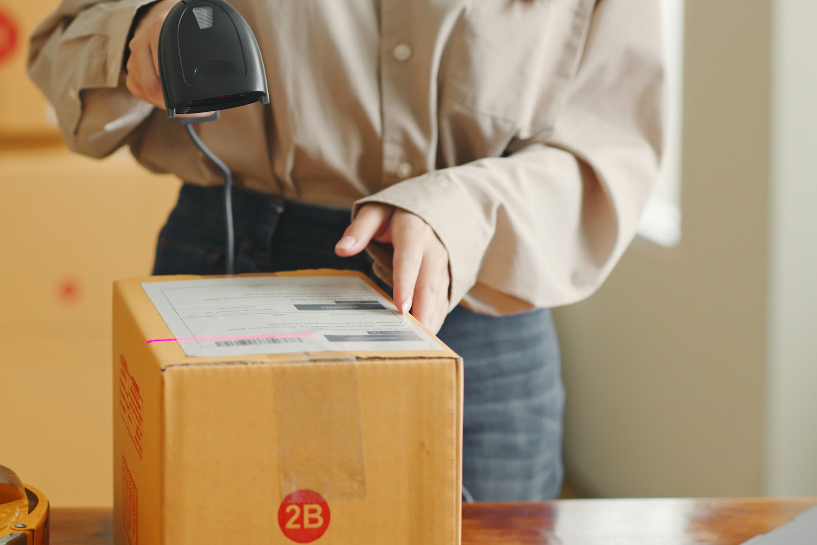 A woman using automation to print shipping labels and tracking numbers.