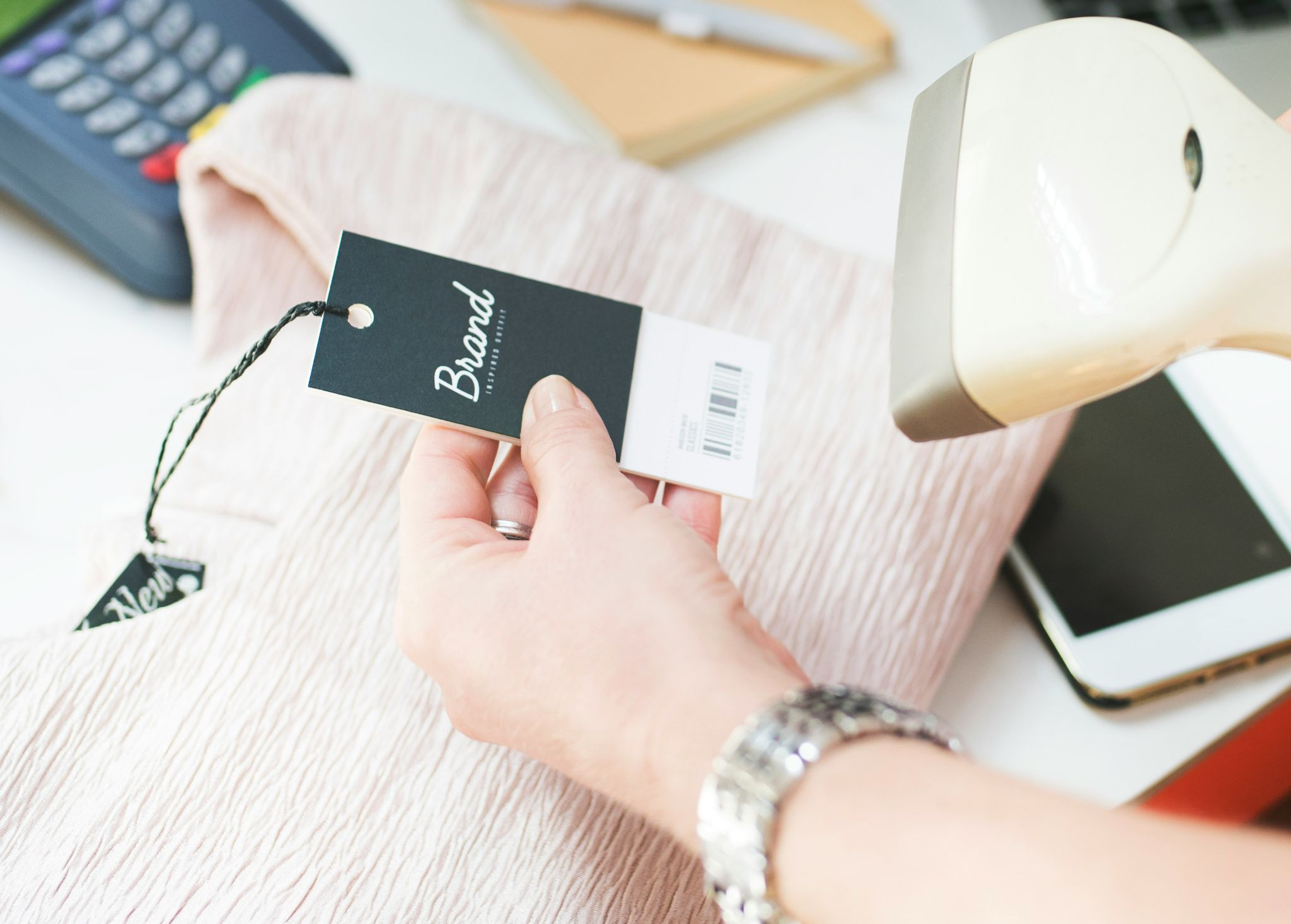 Team applying barcodes and labels to products as part of retail readiness checklist for ecommerce brands.