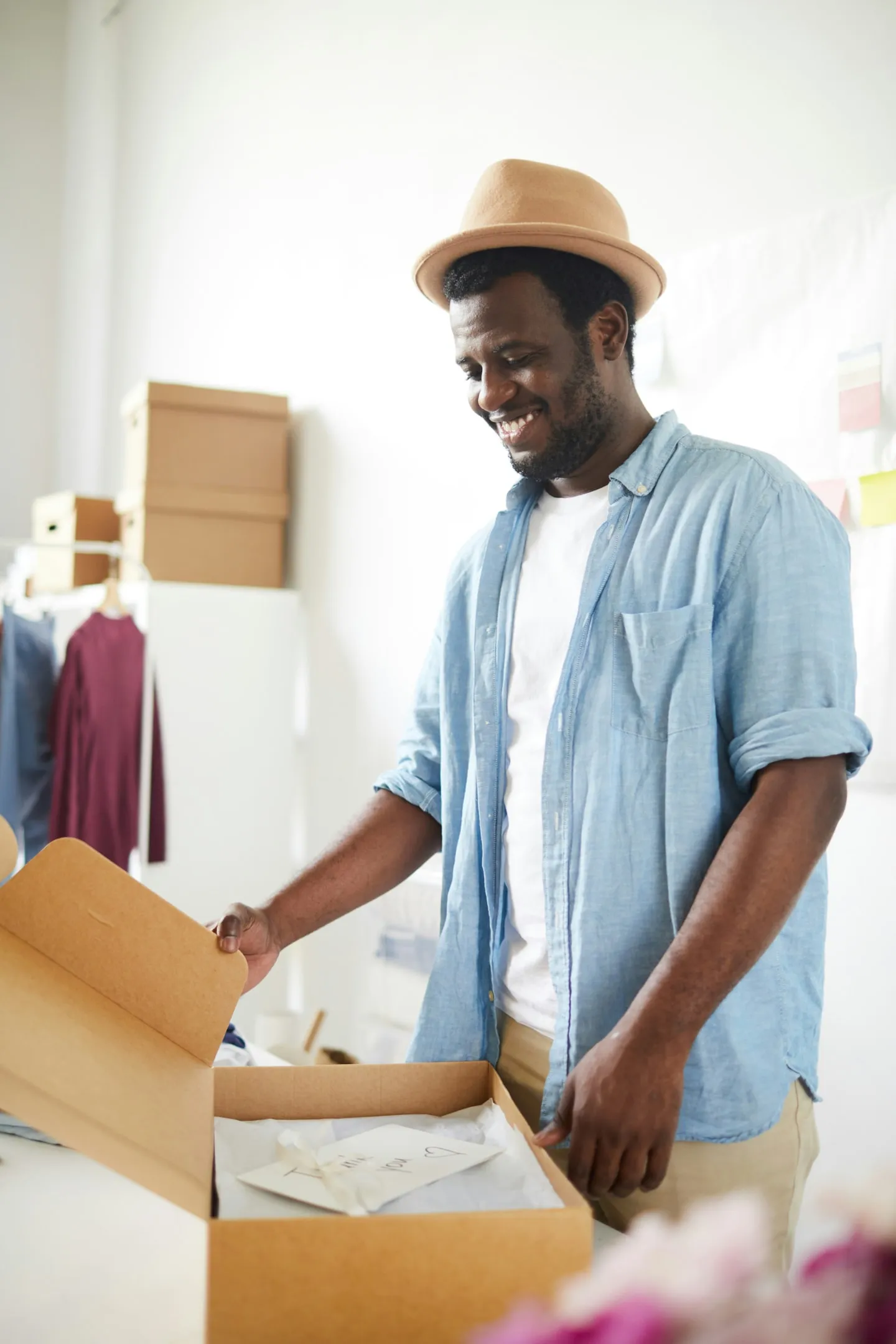 A modern, organized co-warehousing workspace with designated zones for receiving, packing, and inventory management, illustrating how flexible fulfillment support can help ecommerce businesses scale efficiently beyond a home setup.