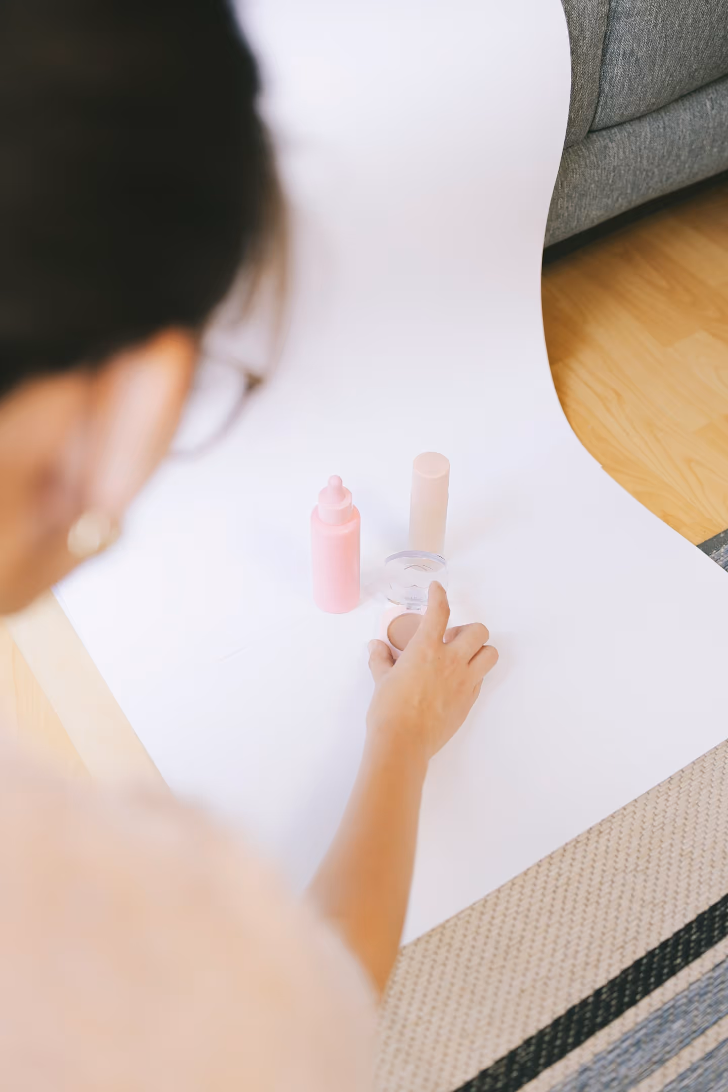 A small business owner organizing products at home, illustrating the challenges of running operations without dedicated warehouse space.