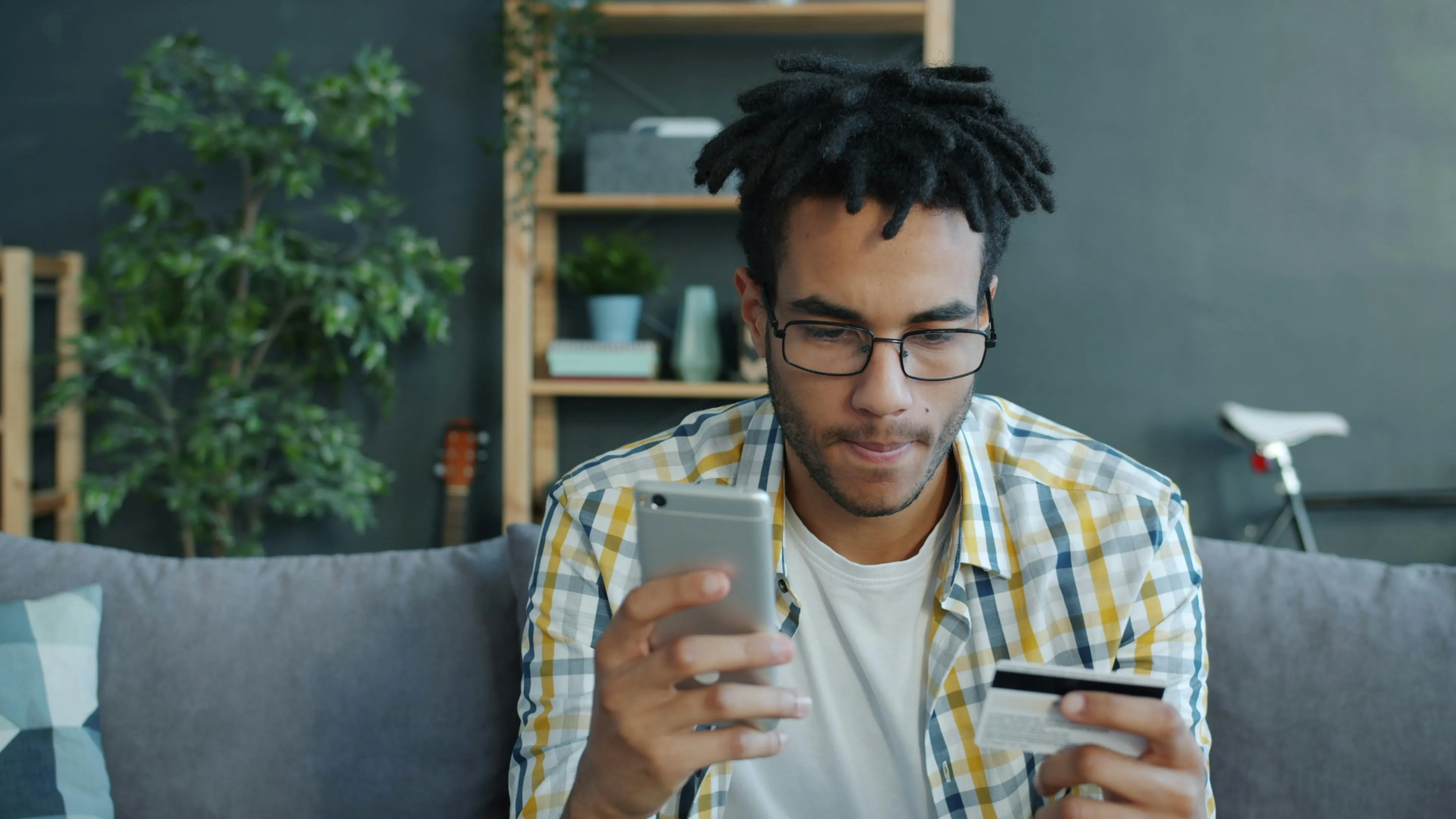 A person using a smartphone to complete an online purchase, highlighting the importance of mobile-friendly checkout processes for reducing cart abandonment during Black Friday ecommerce sales.