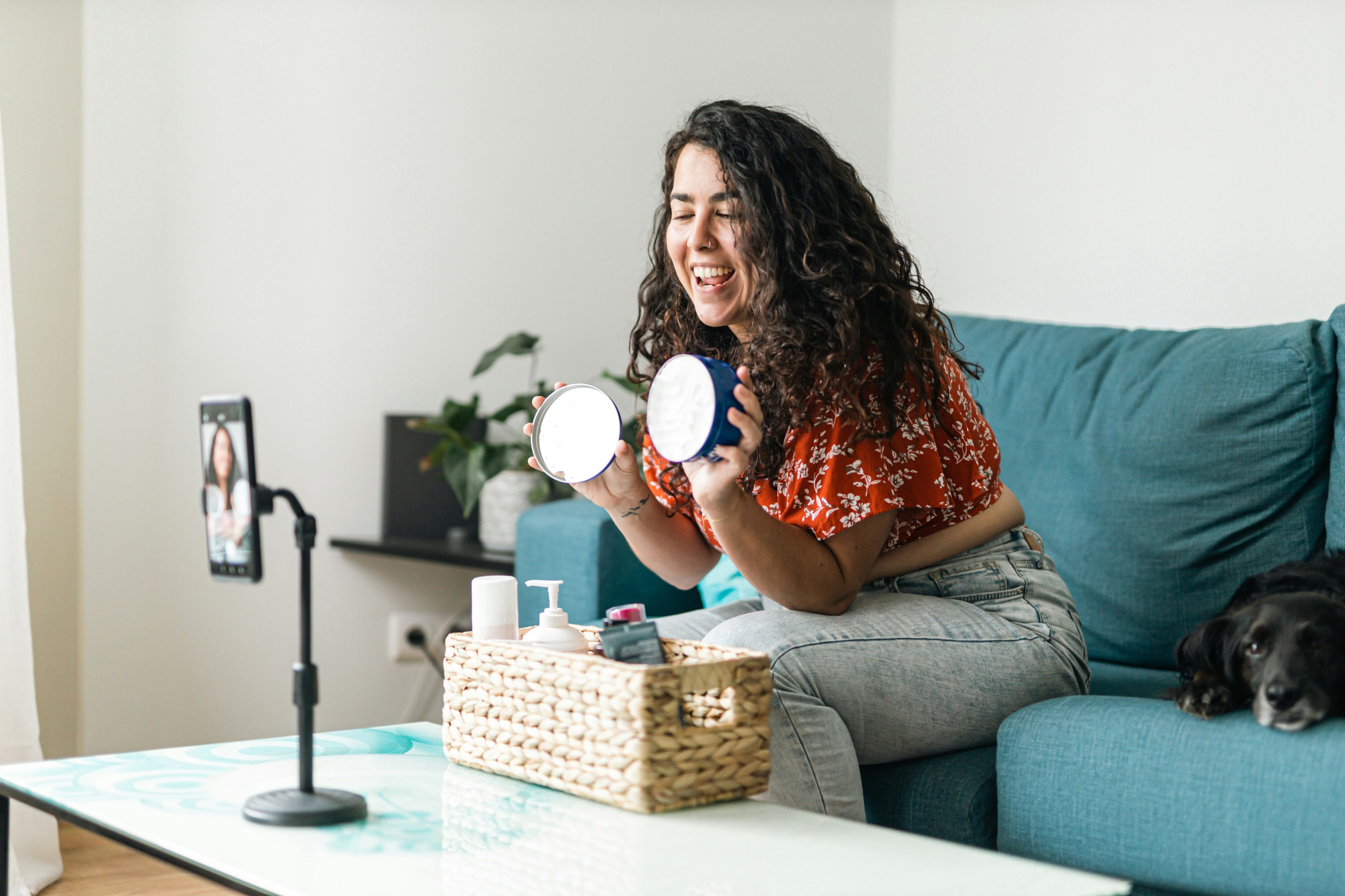 An influencer recording social media content, illustrating how micro-influencers effectively promote Black Friday deals by connecting with targeted audiences and driving ecommerce sales through authentic online interactions.