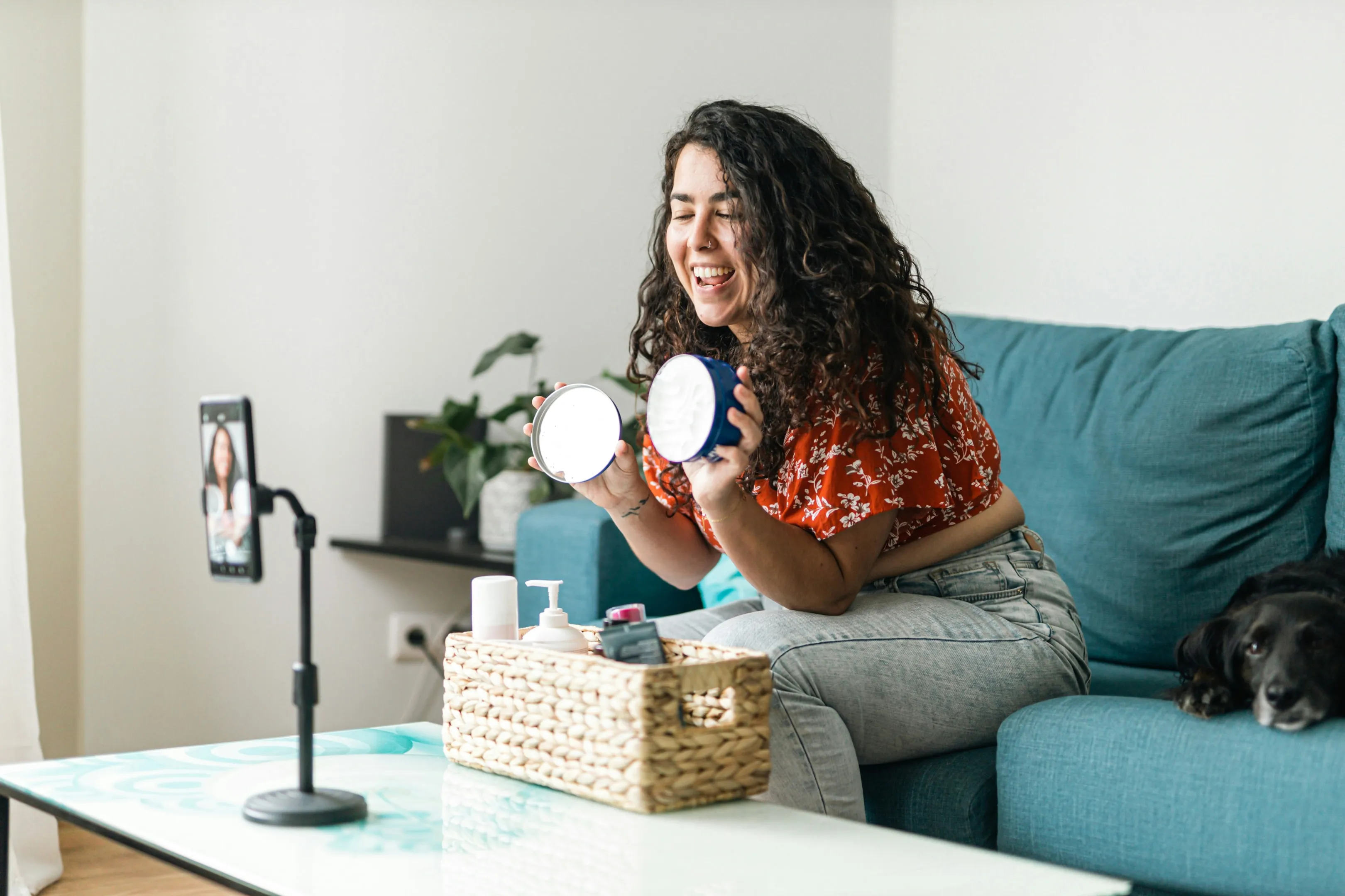 An influencer recording social media content, illustrating how micro-influencers effectively promote Black Friday deals by connecting with targeted audiences and driving ecommerce sales through authentic online interactions.