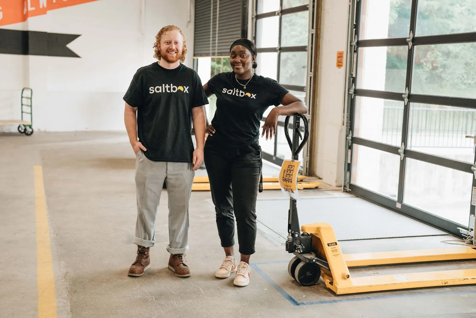 Two small business owners smile as they settle into a 3PL alternative that fits their business needs.