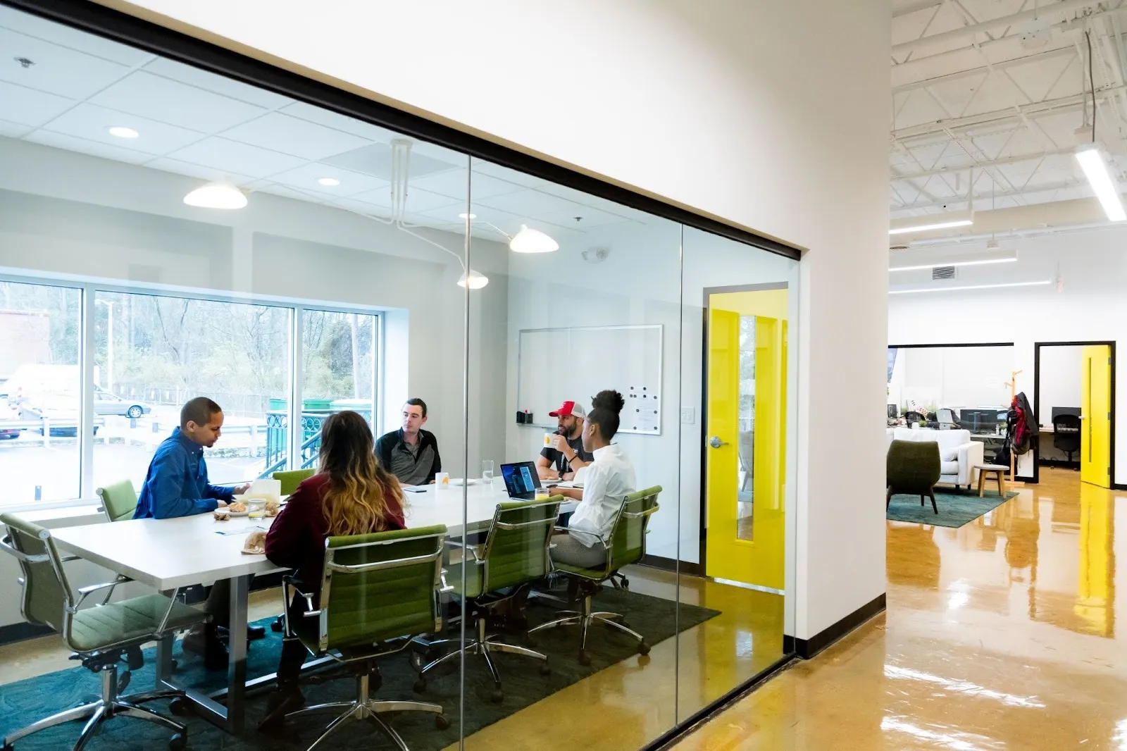 A leadership team gathers around a table as they discuss the implications of the new 2026 tariff updates and what it means for ecommerce brands.