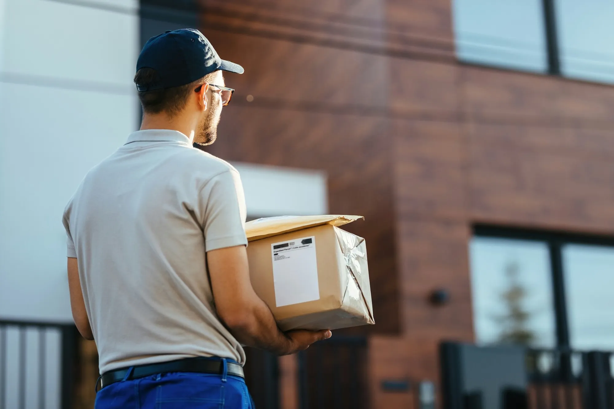 A shipping carrier delivery driver delivering packages that were charged a carrier surcharge from hidden 3pl fees.