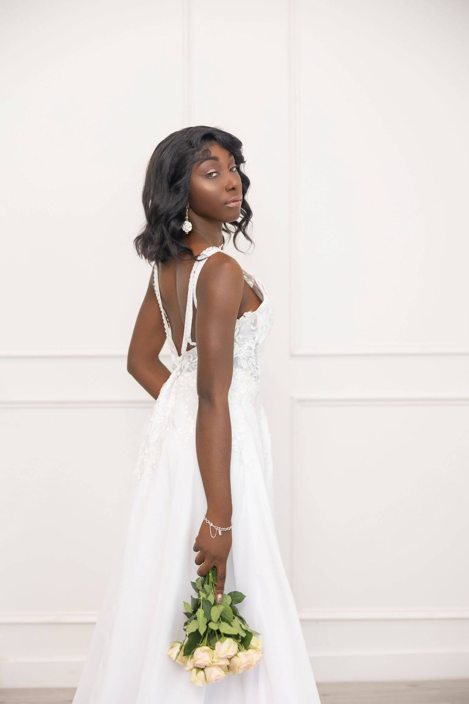 Young, black bride in wedding dress with beautiful, timeless makeup done by OKOS Creations.