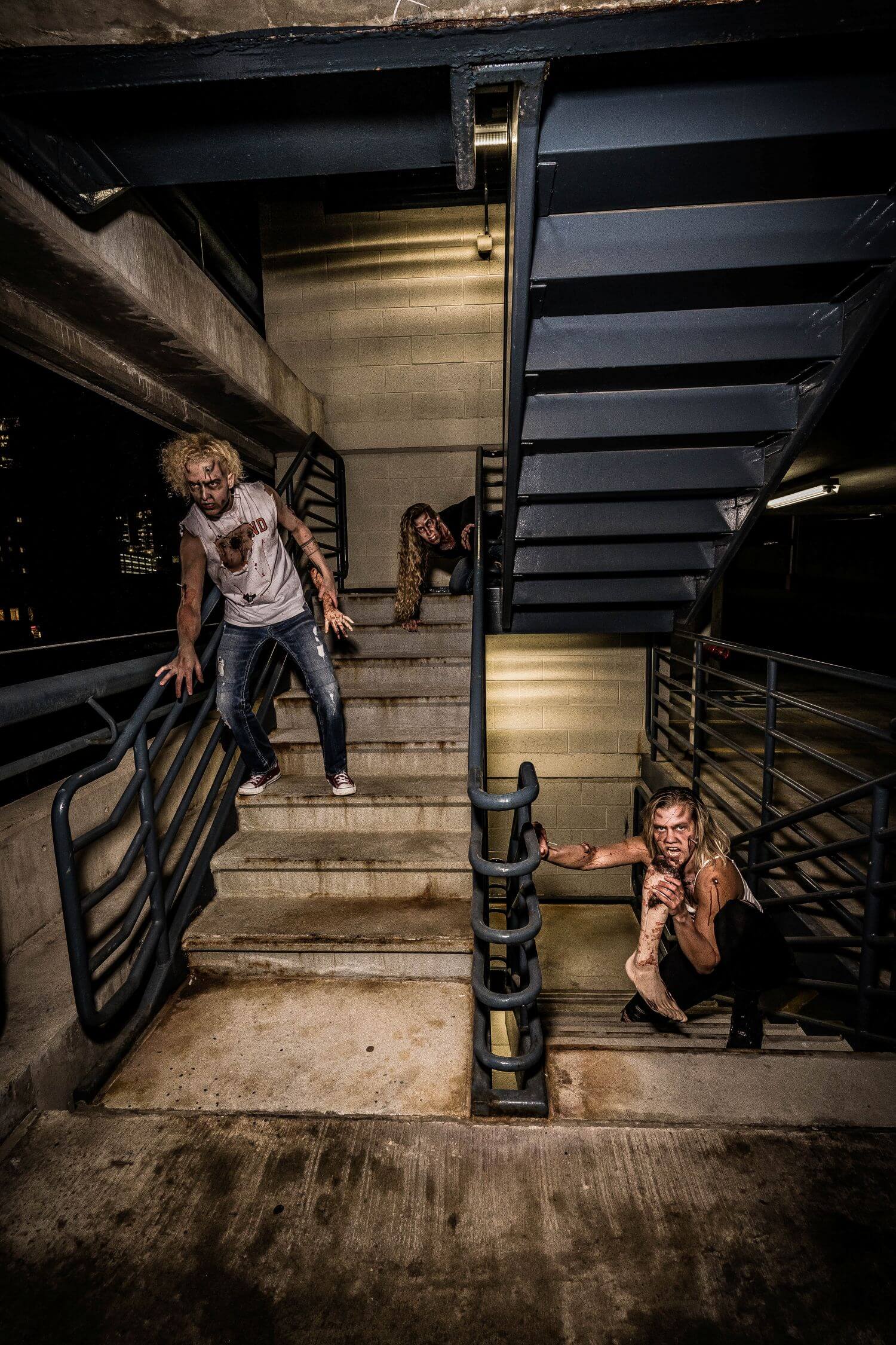 Group of zombies on stairwell. Creative makeup done by OKOS Creations.