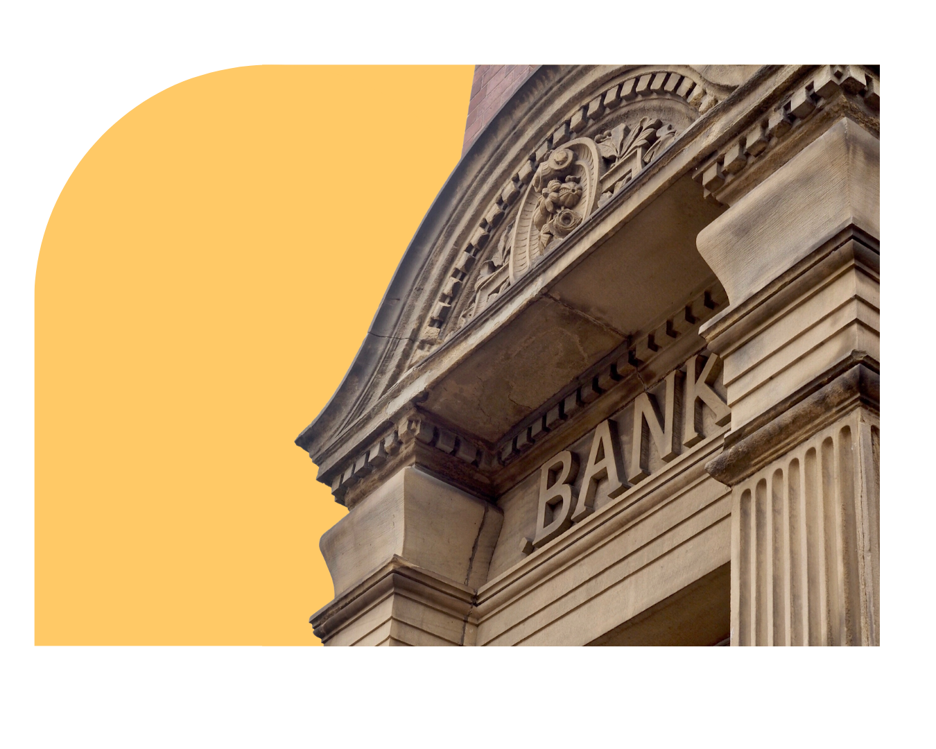 Stone facade of a bank building with ornate arch and large BANK letters.