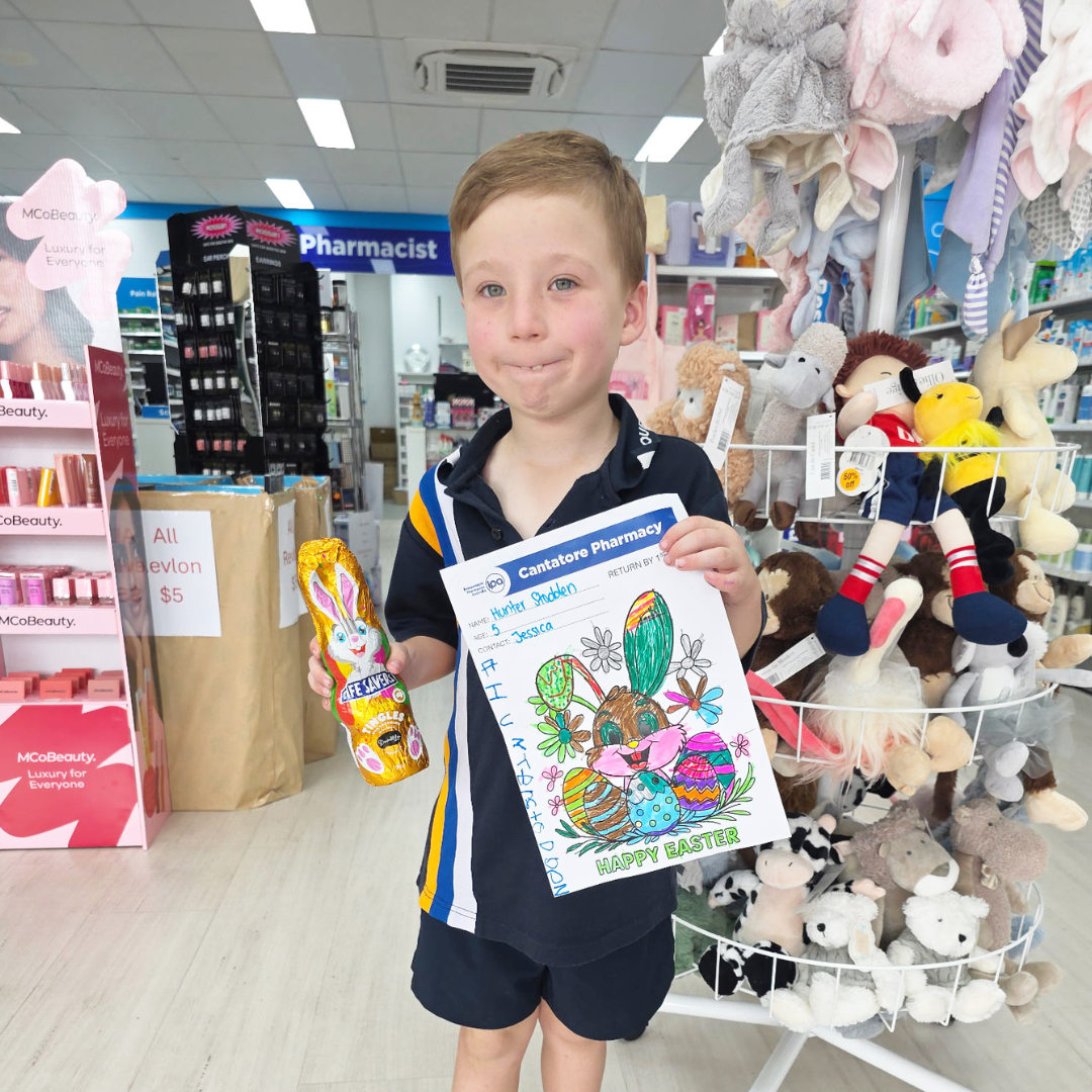 Hunter 3-5 year old winner, inside Cantatore Pharmacy with his chocolate bunny prize.