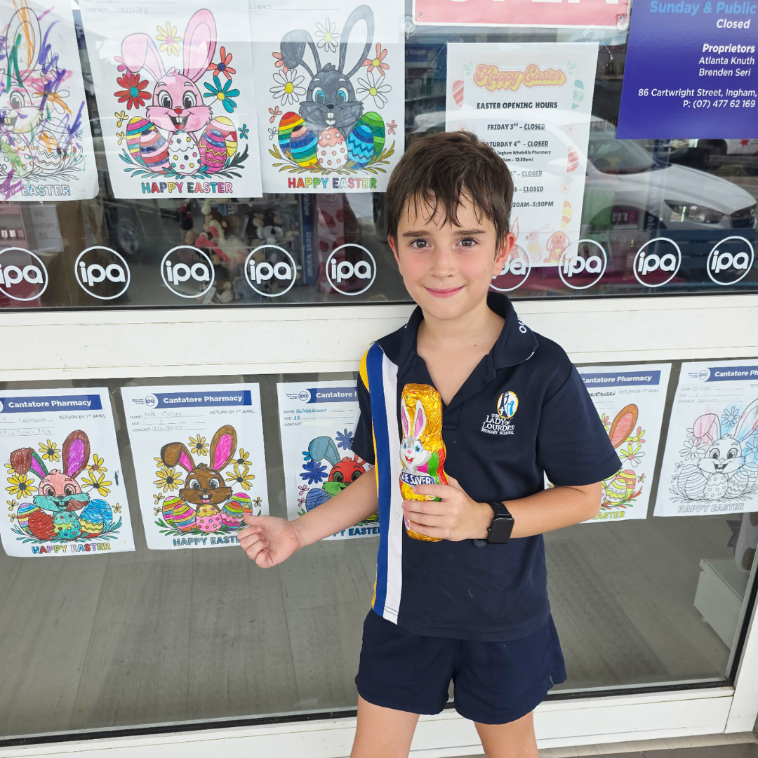Kade 6-9 year old winner, pointing out his artwork.