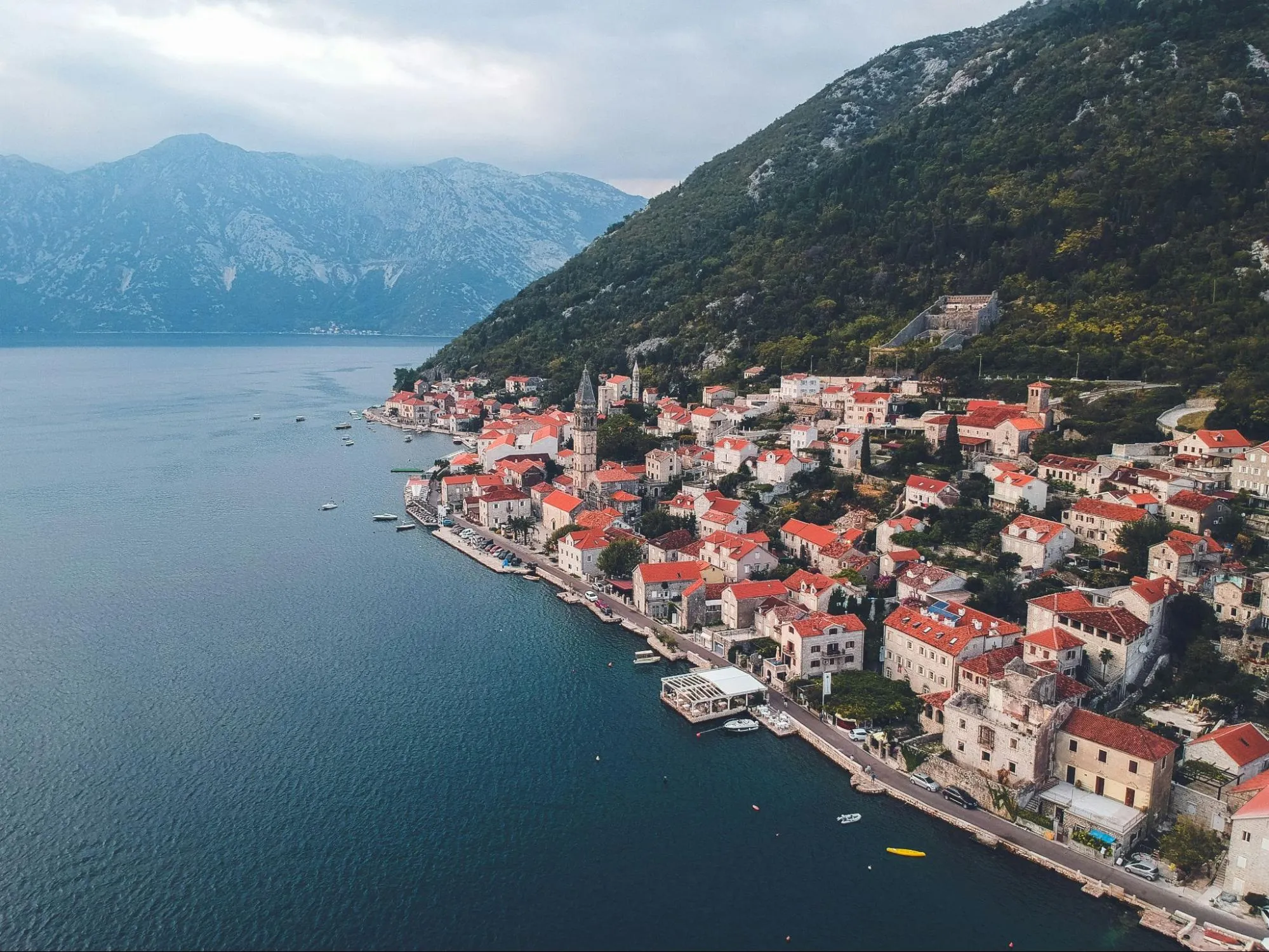 Wide eye shot of the real estate properties along the coast in Perast, Montenegro.
