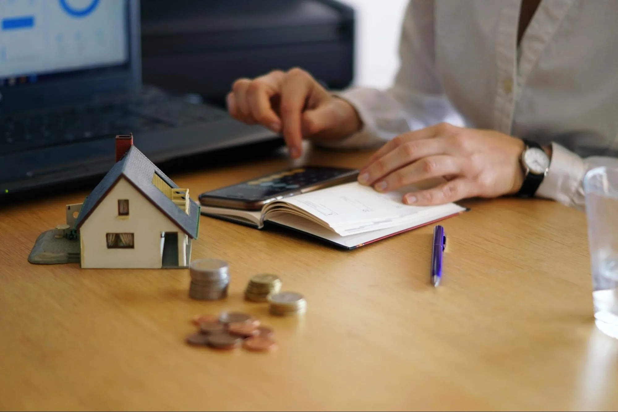 A person calculating his real estate fund.