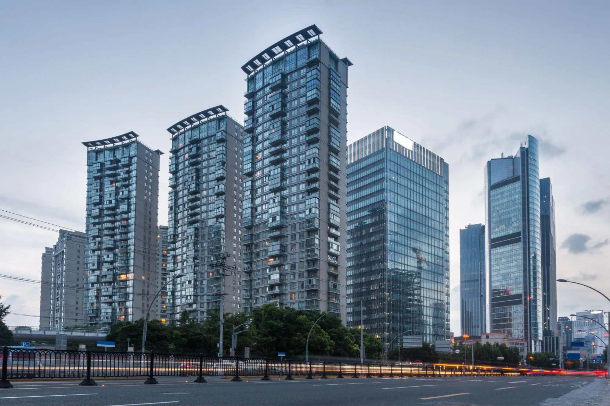 A wide-angle shot of commercial real estate buildings in an urban city.