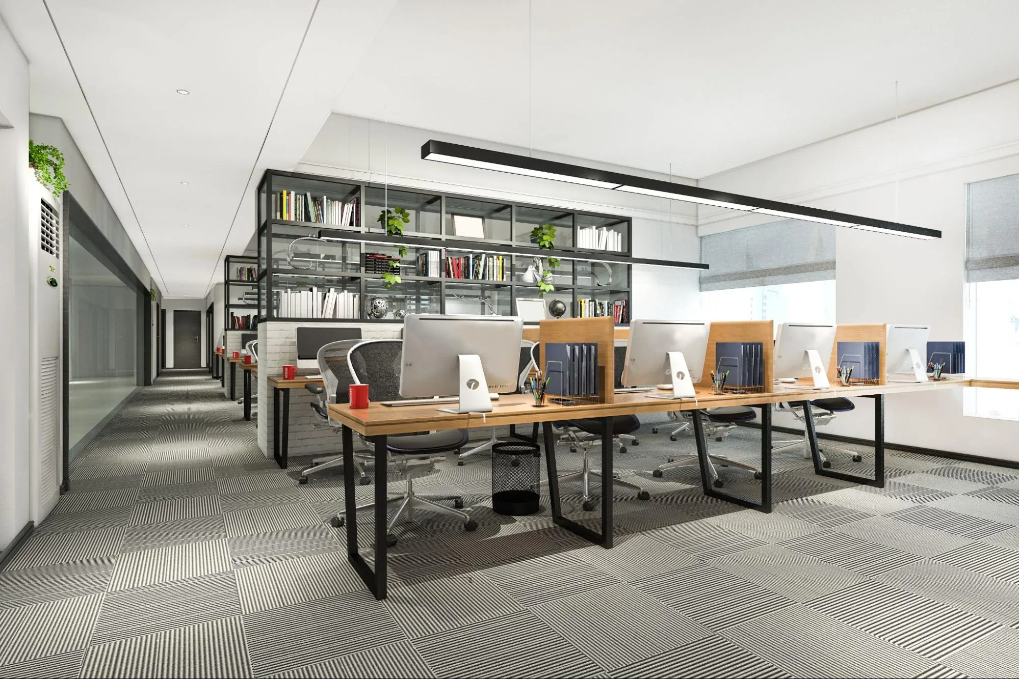 A commercial office space setup with tables and computers.