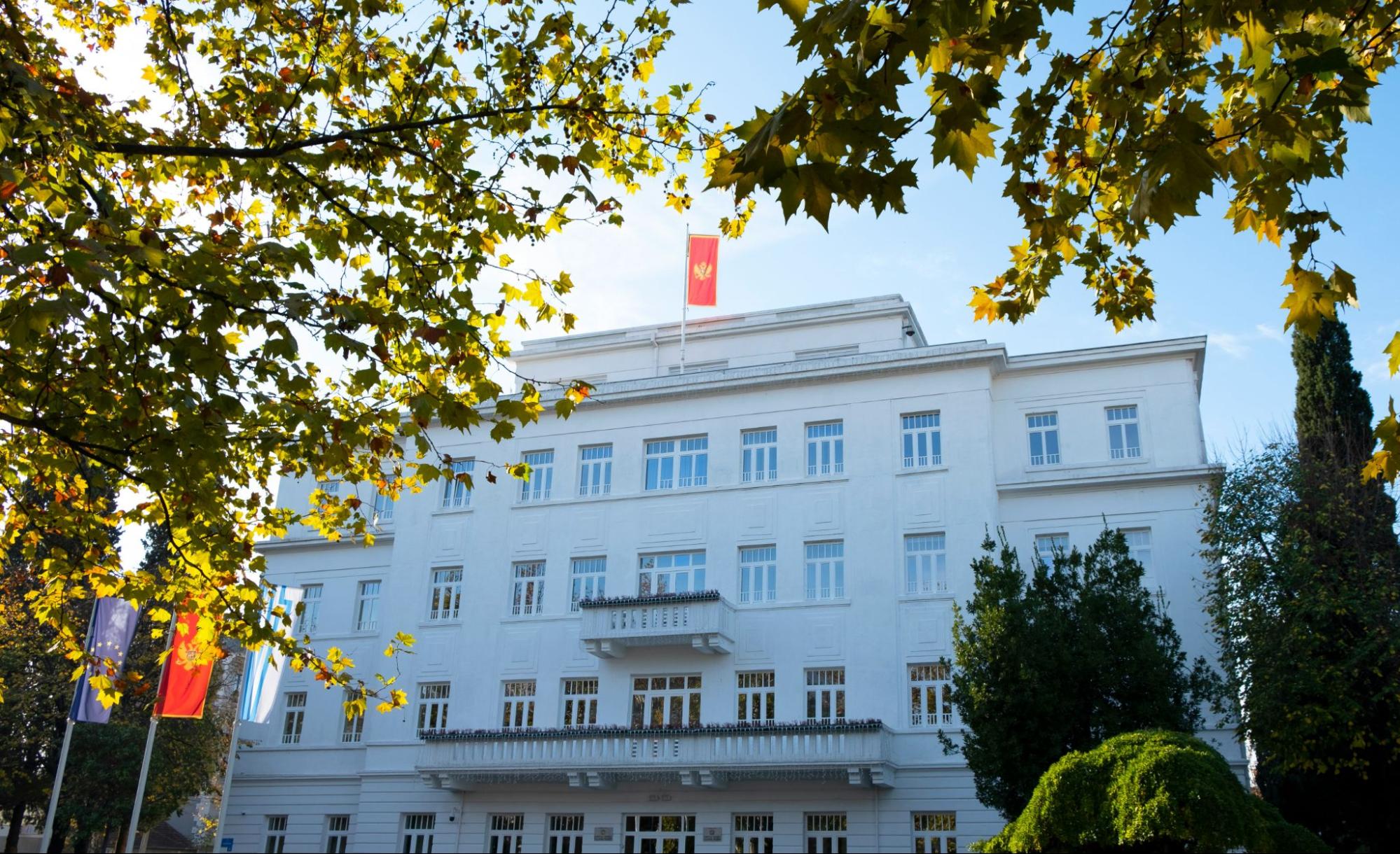 The municipal assembly of Podgorica pictured amidst the trees.
