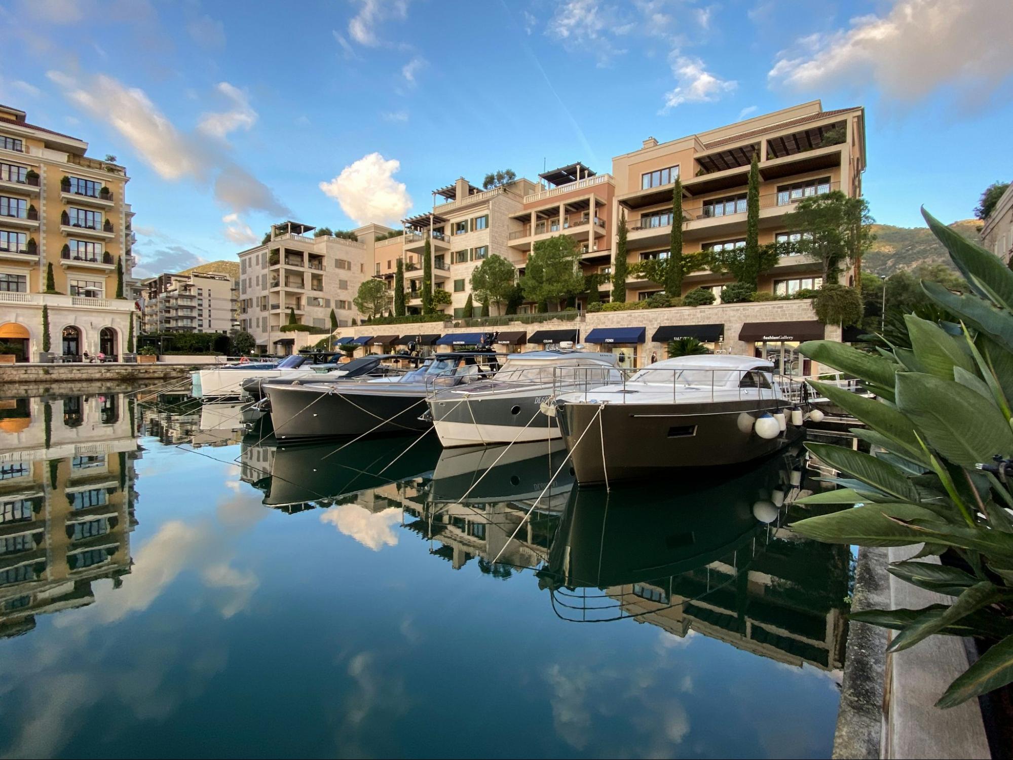 Shot of yachts and buildings in Tivat.