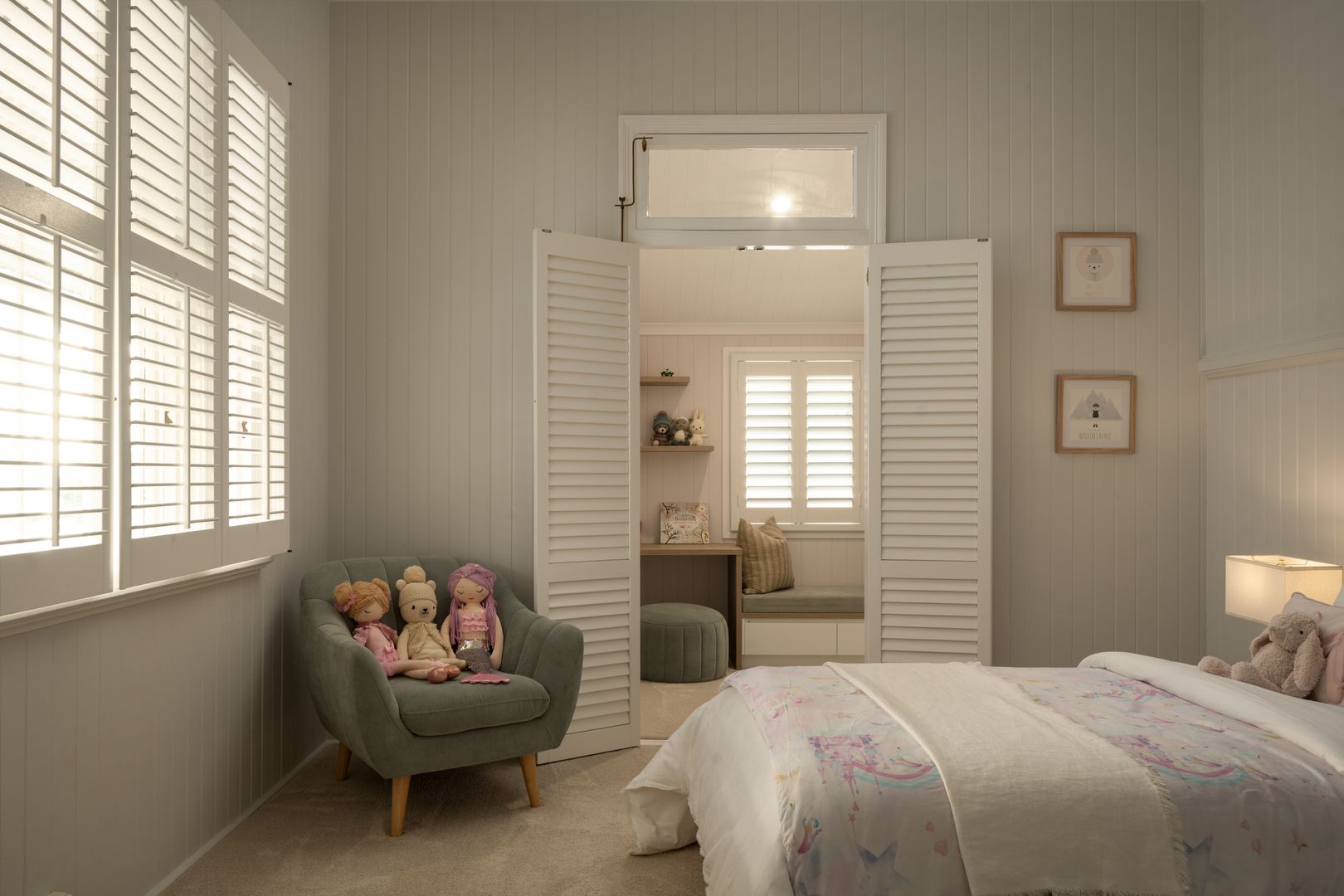 Childs bedroom with a window and feature chair in the corner 