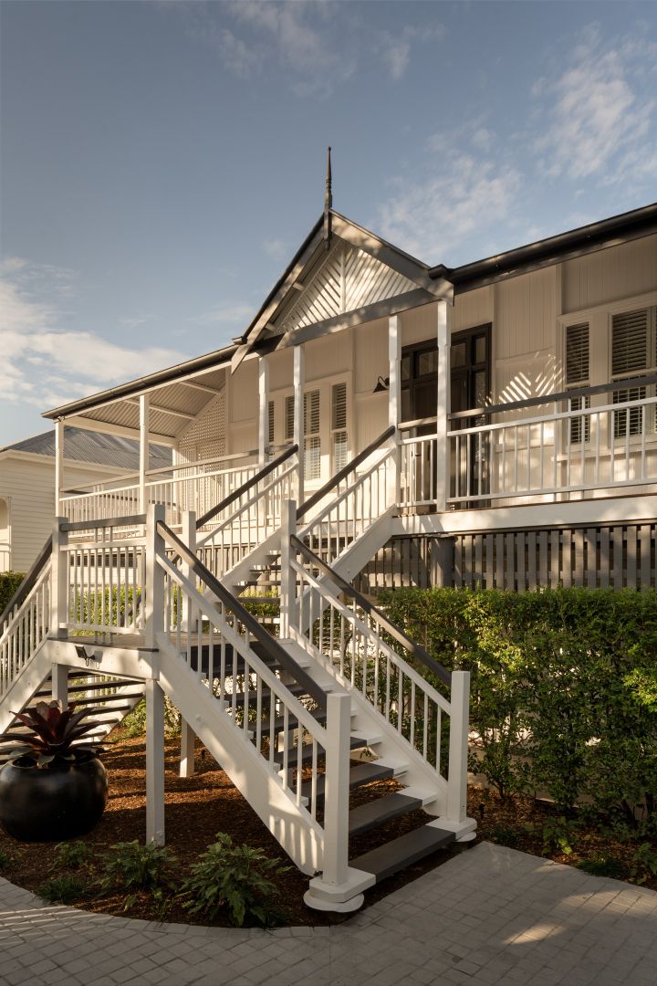 Close up of the classic staircase leading to the front door in this renovated modern Queenslander 