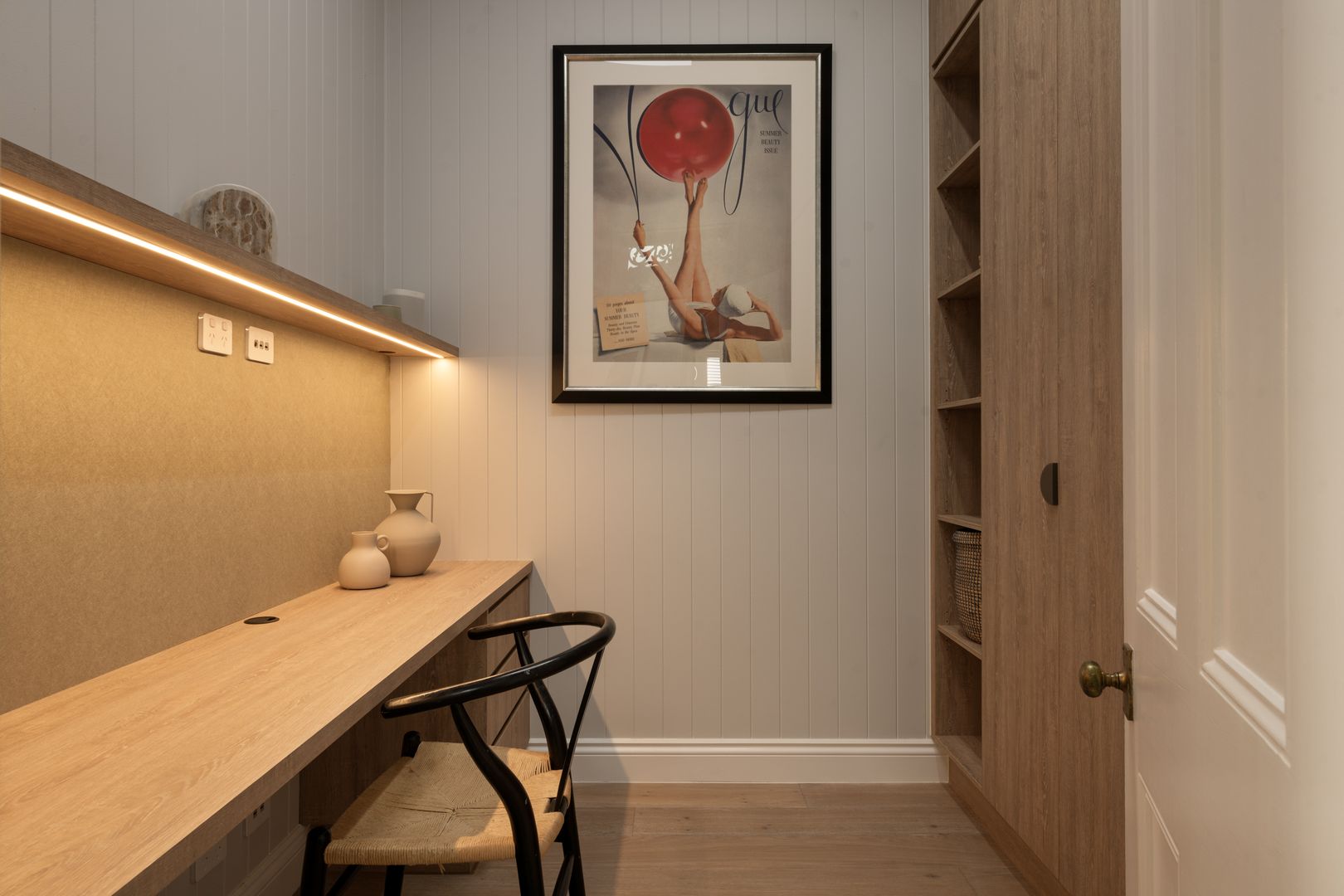 Study nook with built in desk, chair and custom cabinetry