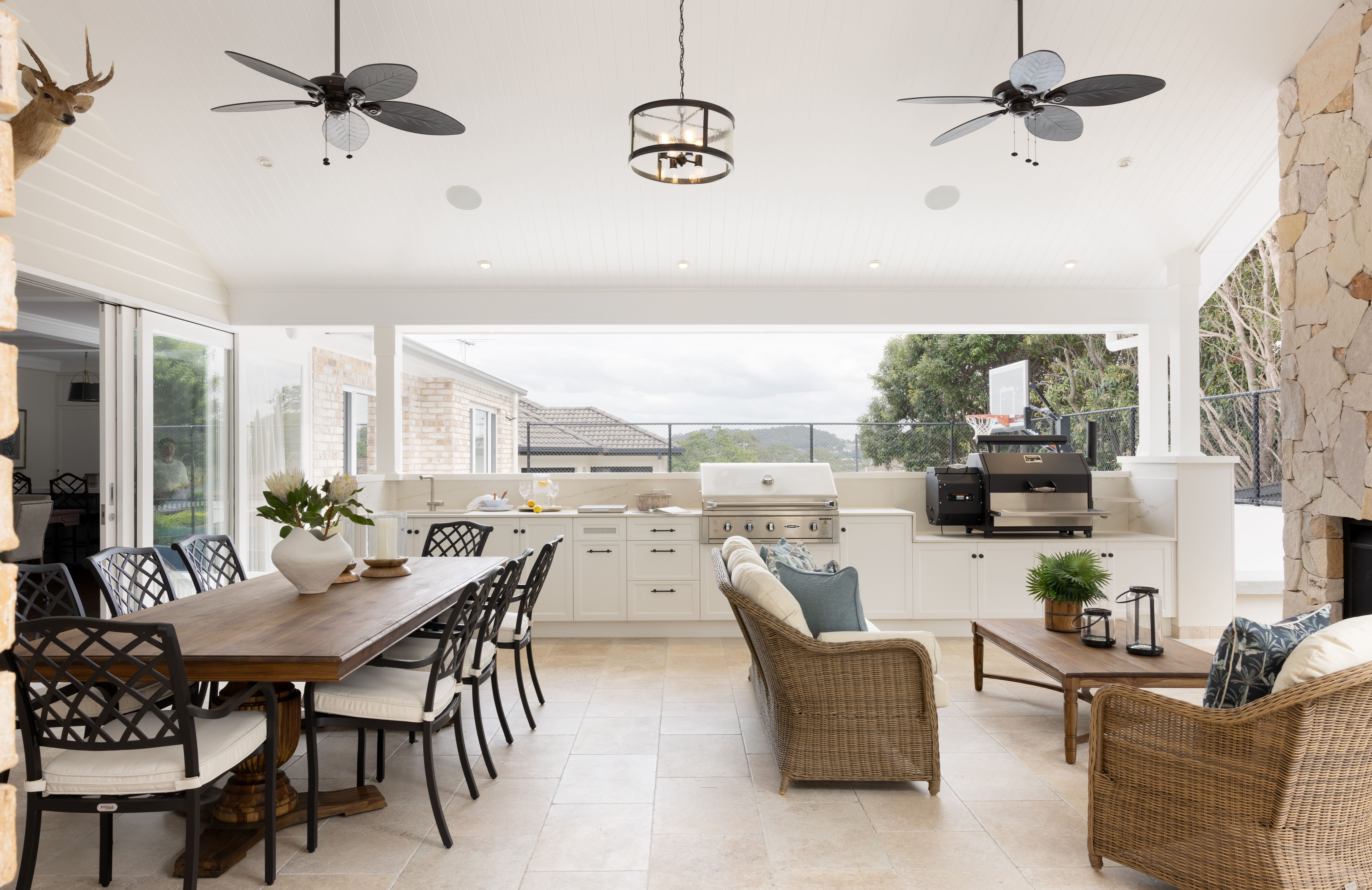 Outdoor alfresco with dining, lounge and outdoor kitchen zones.