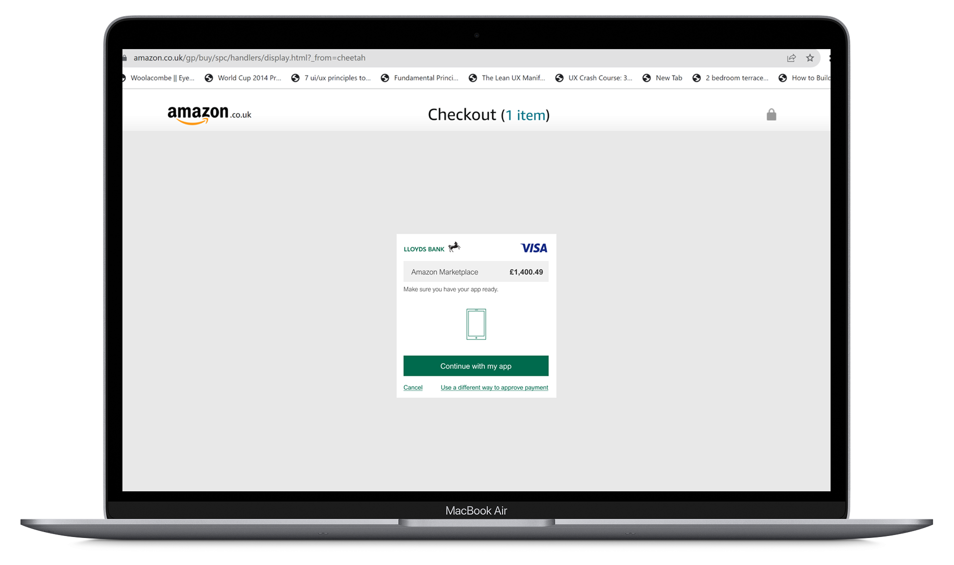 Amazon.co.uk checkout page showing Lloyds Bank Visa payment approval prompt for £1,400.49 with options to continue with app or cancel.