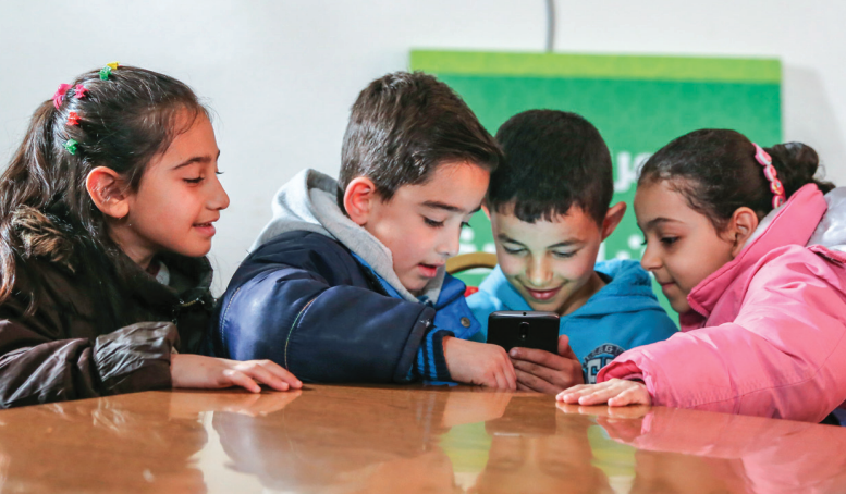 Kids playing Curious Reader