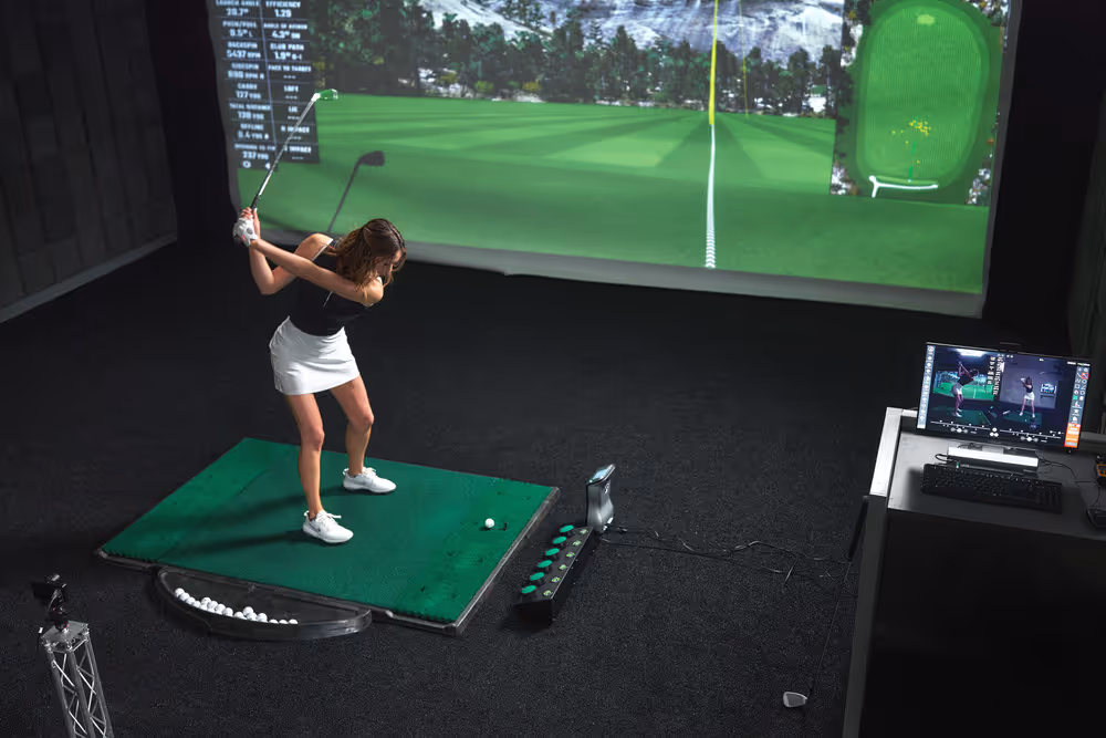 Golfer practicing in GOLFTEC Bay